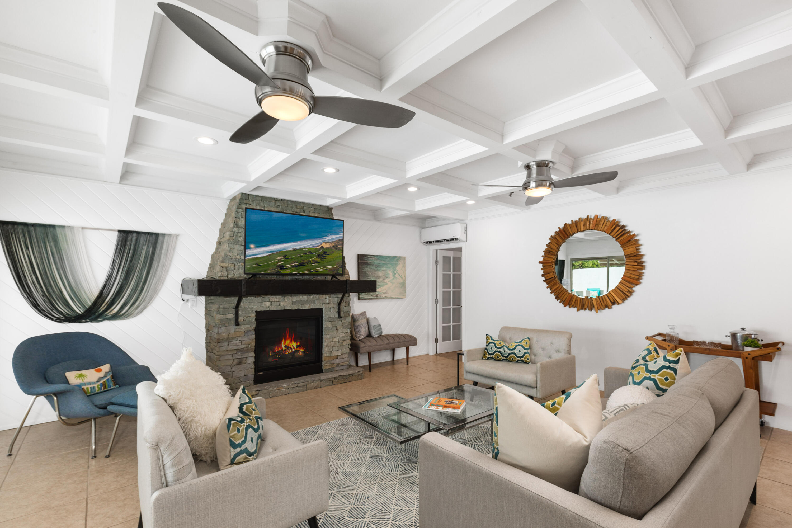70050 Chappel Road Rancho Mirage, CA 92270 - Photo 15 of 36 a living room with furniture a fireplace and a flat screen tv