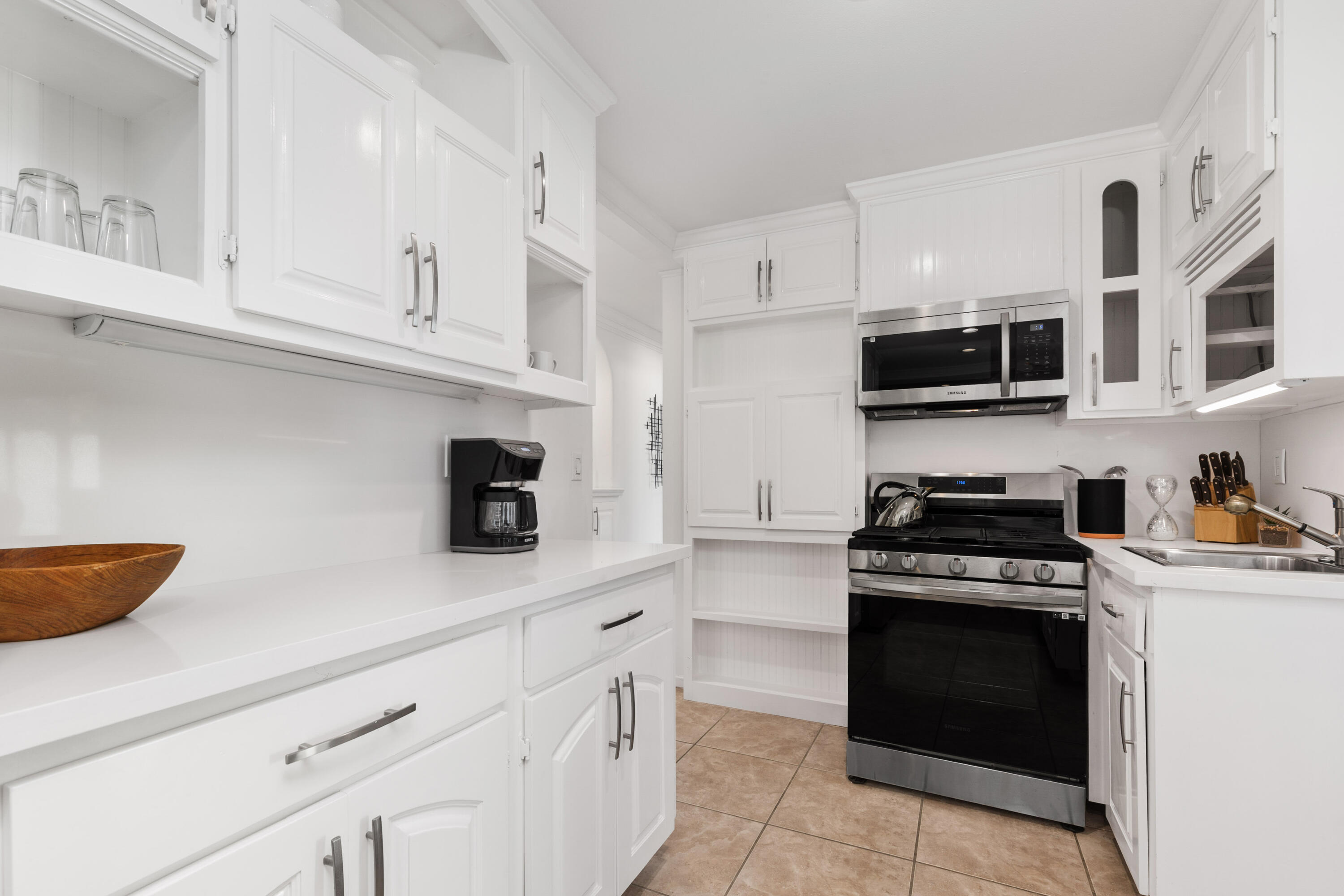 70050 Chappel Road Rancho Mirage, CA 92270 - Photo 20 of 36 a kitchen with cabinets stainless steel appliances and a counter space