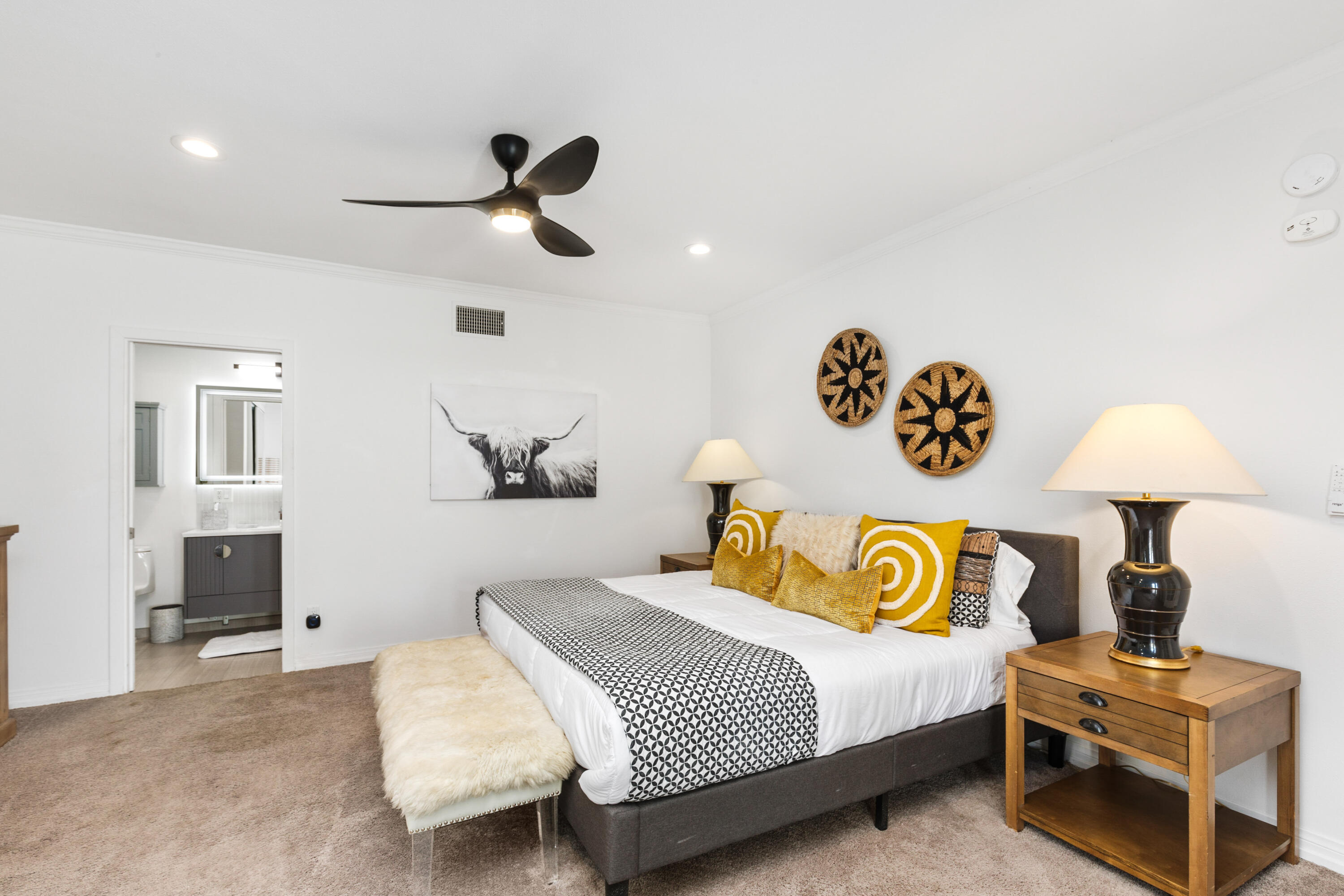 70050 Chappel Road Rancho Mirage, CA 92270 - Photo 24 of 36 a bedroom with a bed and a lamp on table