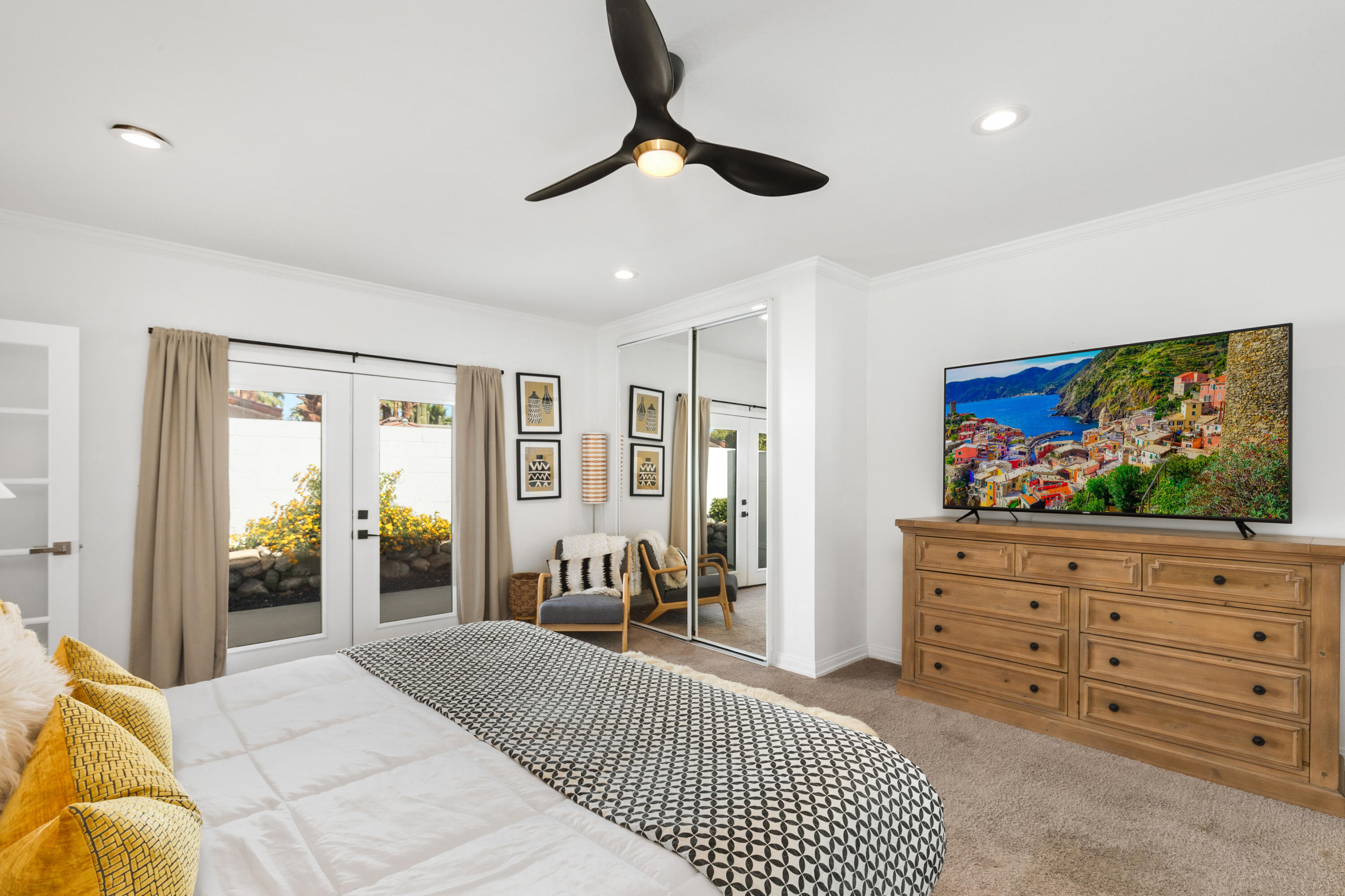70050 Chappel Road Rancho Mirage, CA 92270 - Photo 25 of 36 a bedroom with a bed and a flat screen tv