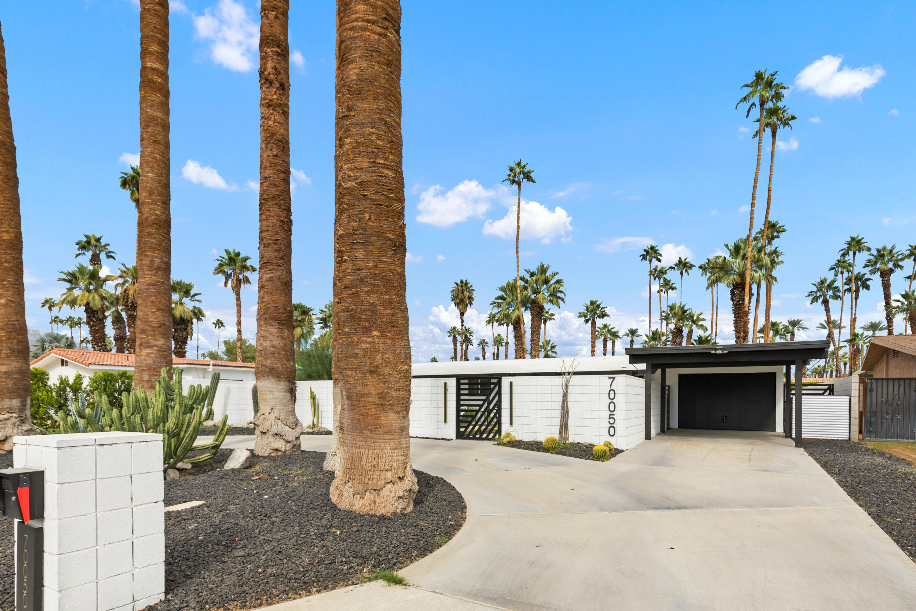 70050 Chappel Road Rancho Mirage, CA 92270 - Photo 3 of 36 a building view with a garden space