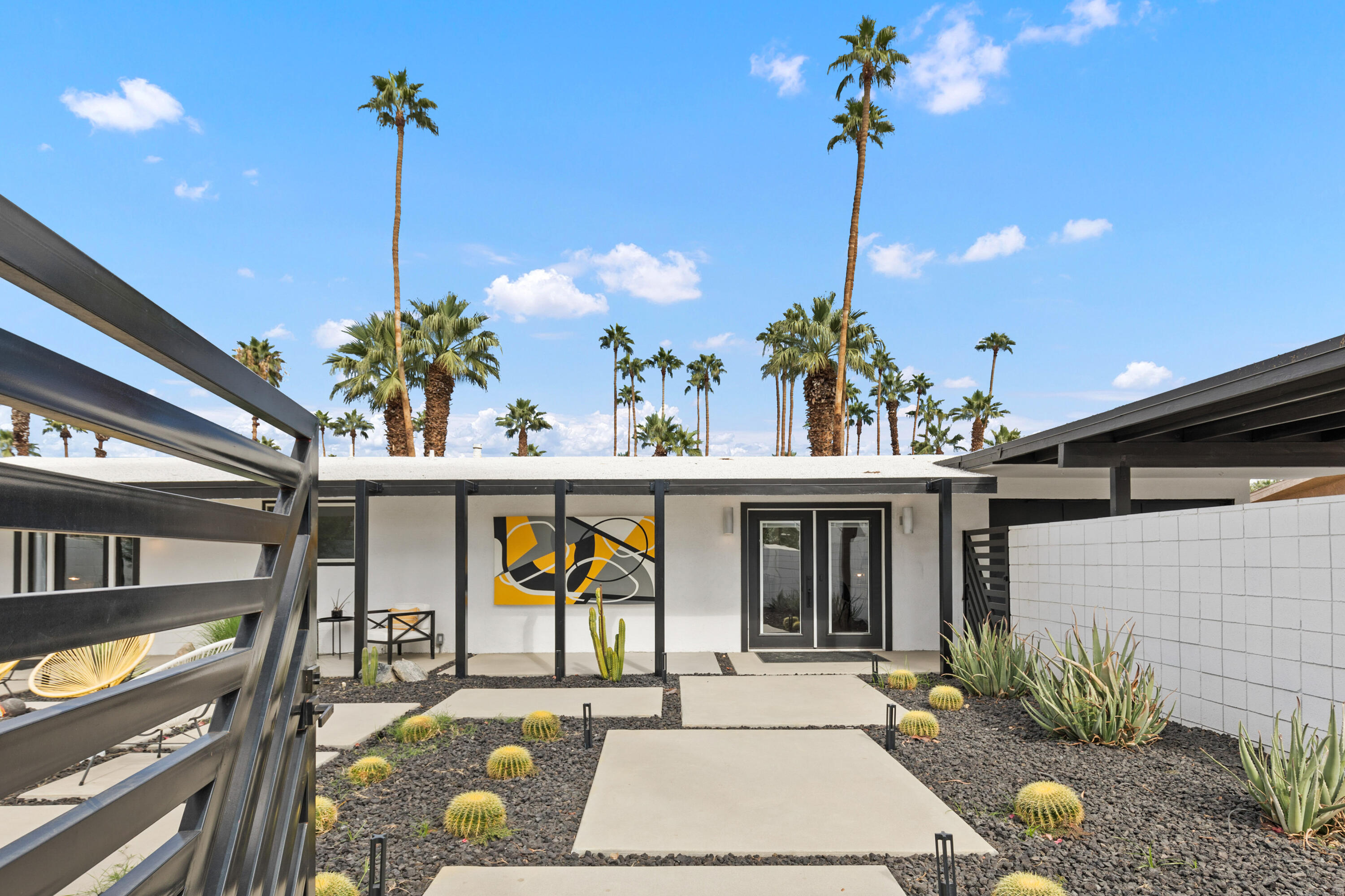 70050 Chappel Road Rancho Mirage, CA 92270 - Photo 5 of 36 a front view of a building with garden