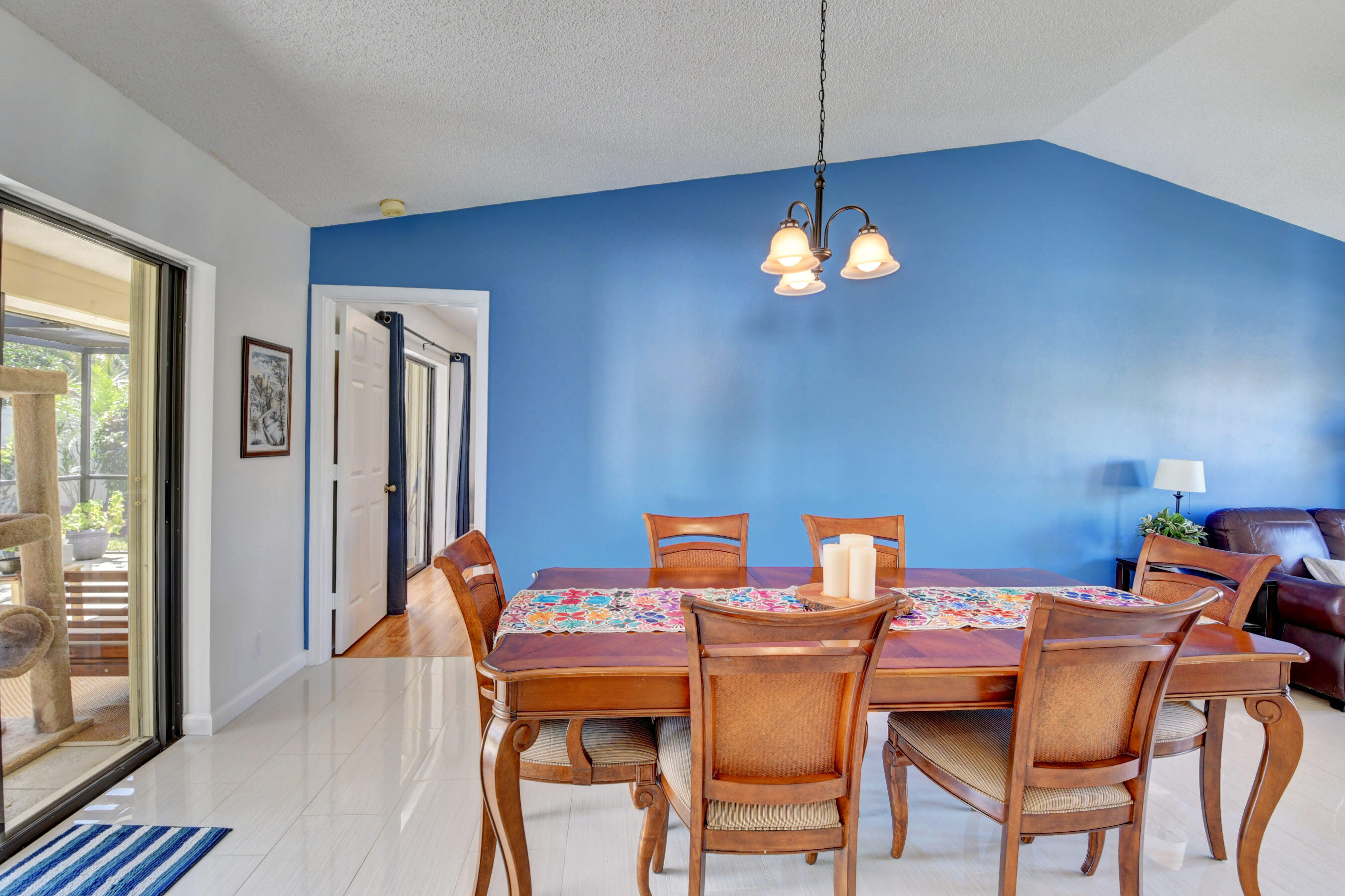 4192 Woods End Road Boca Raton, FL 33487 - Photo 13 of 63 a dining room with a table and chairs