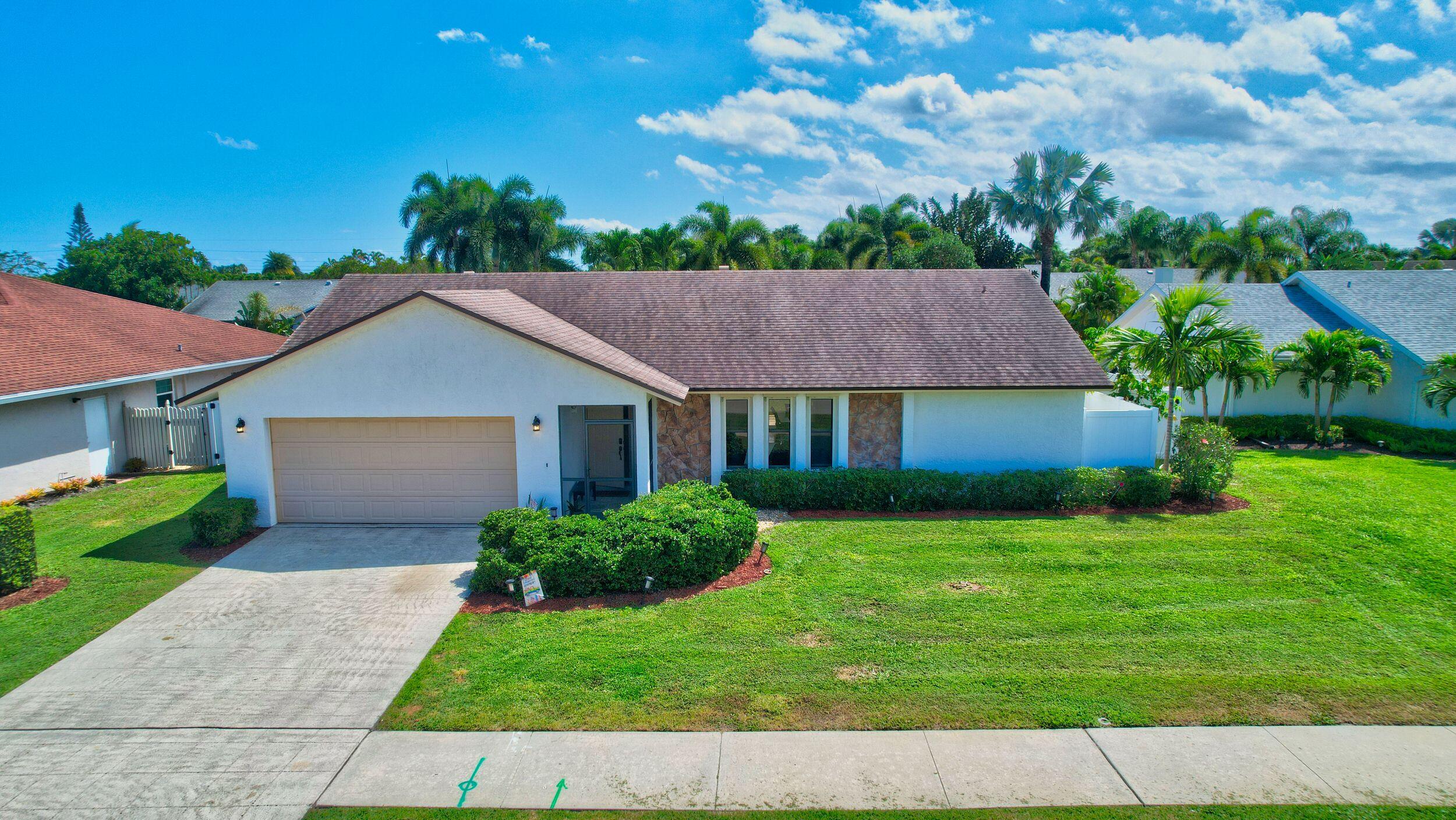 4192 Woods End Road Boca Raton, FL 33487 - Photo 2 of 63 a aerial view of a house next to a yard