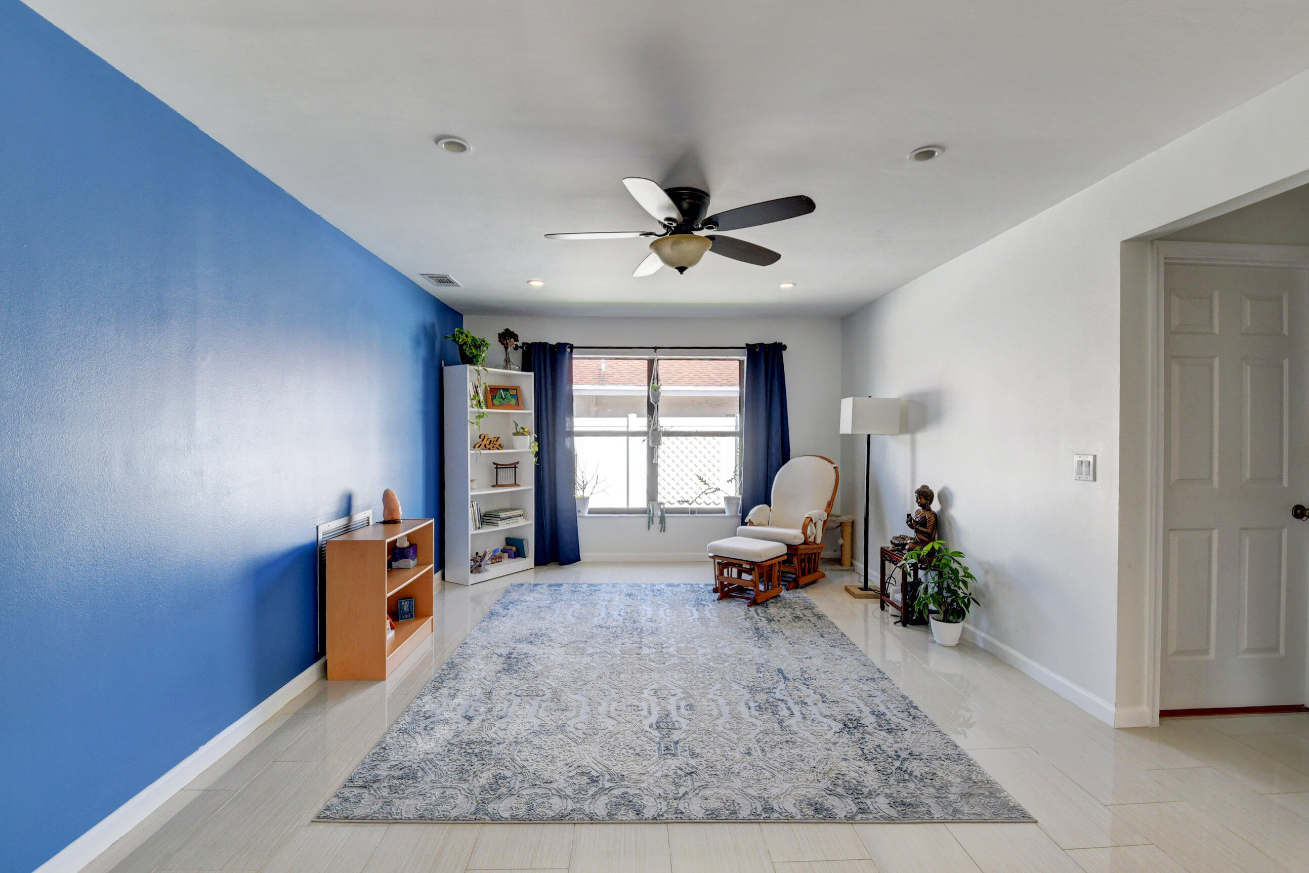 4192 Woods End Road Boca Raton, FL 33487 - Photo 22 of 63 a living room with furniture gym equipment and a window