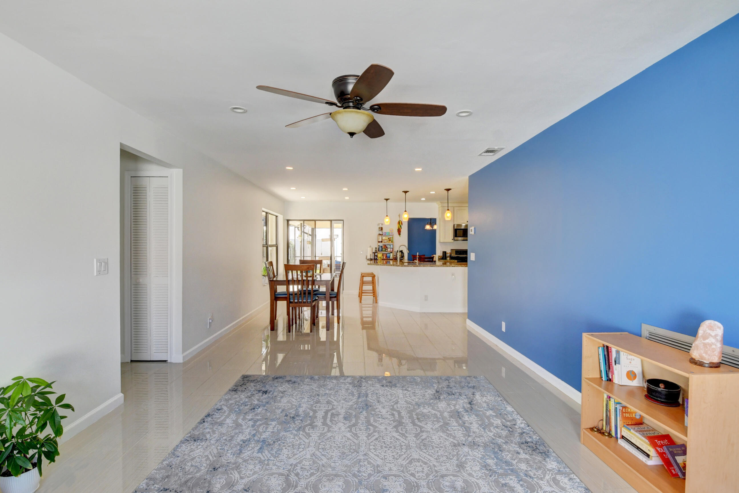 4192 Woods End Road Boca Raton, FL 33487 - Photo 24 of 63 a view of a livingroom with furniture and a ceiling fan