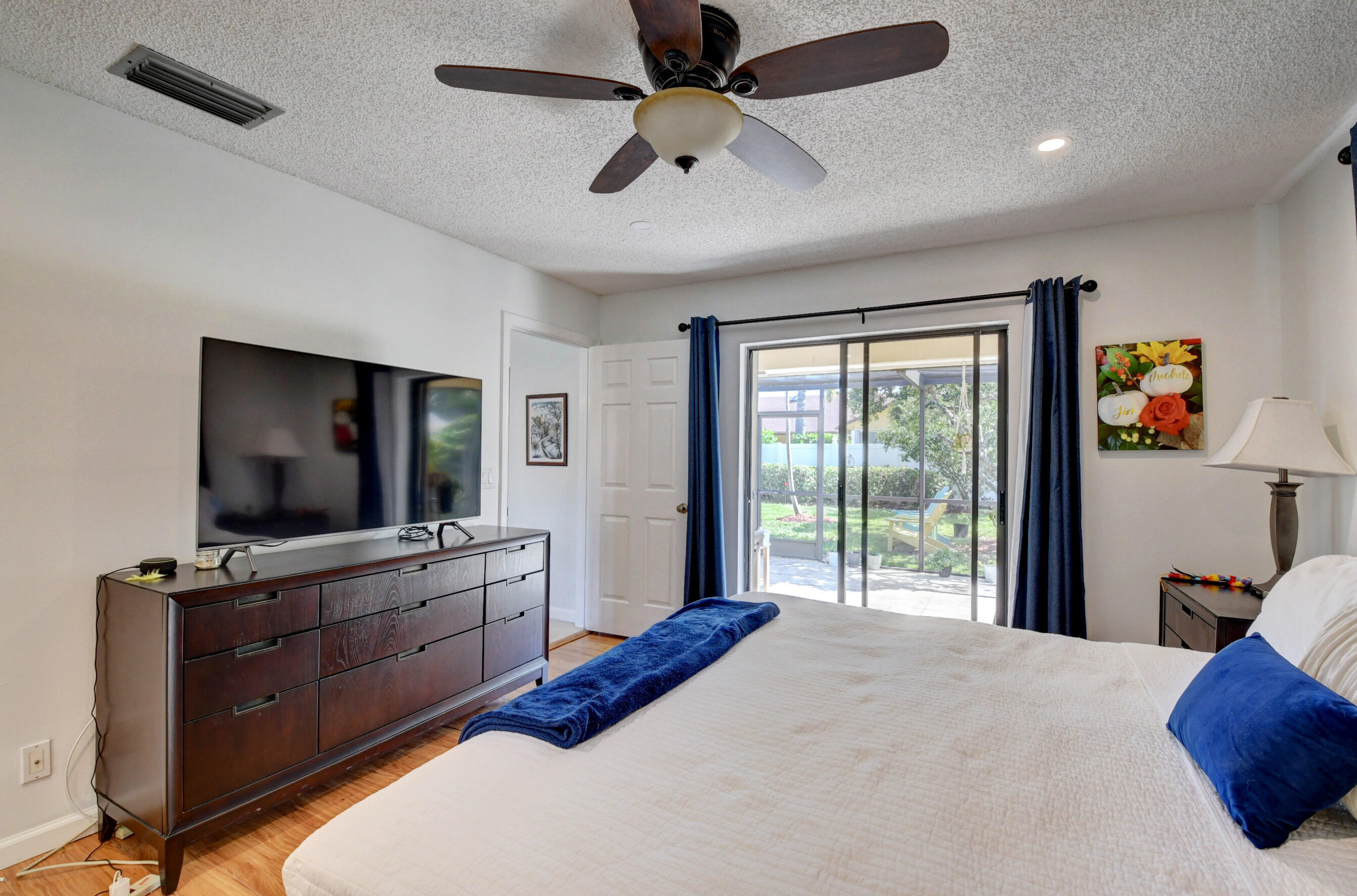 4192 Woods End Road Boca Raton, FL 33487 - Photo 33 of 63 a bedroom with a bed and a flat screen tv