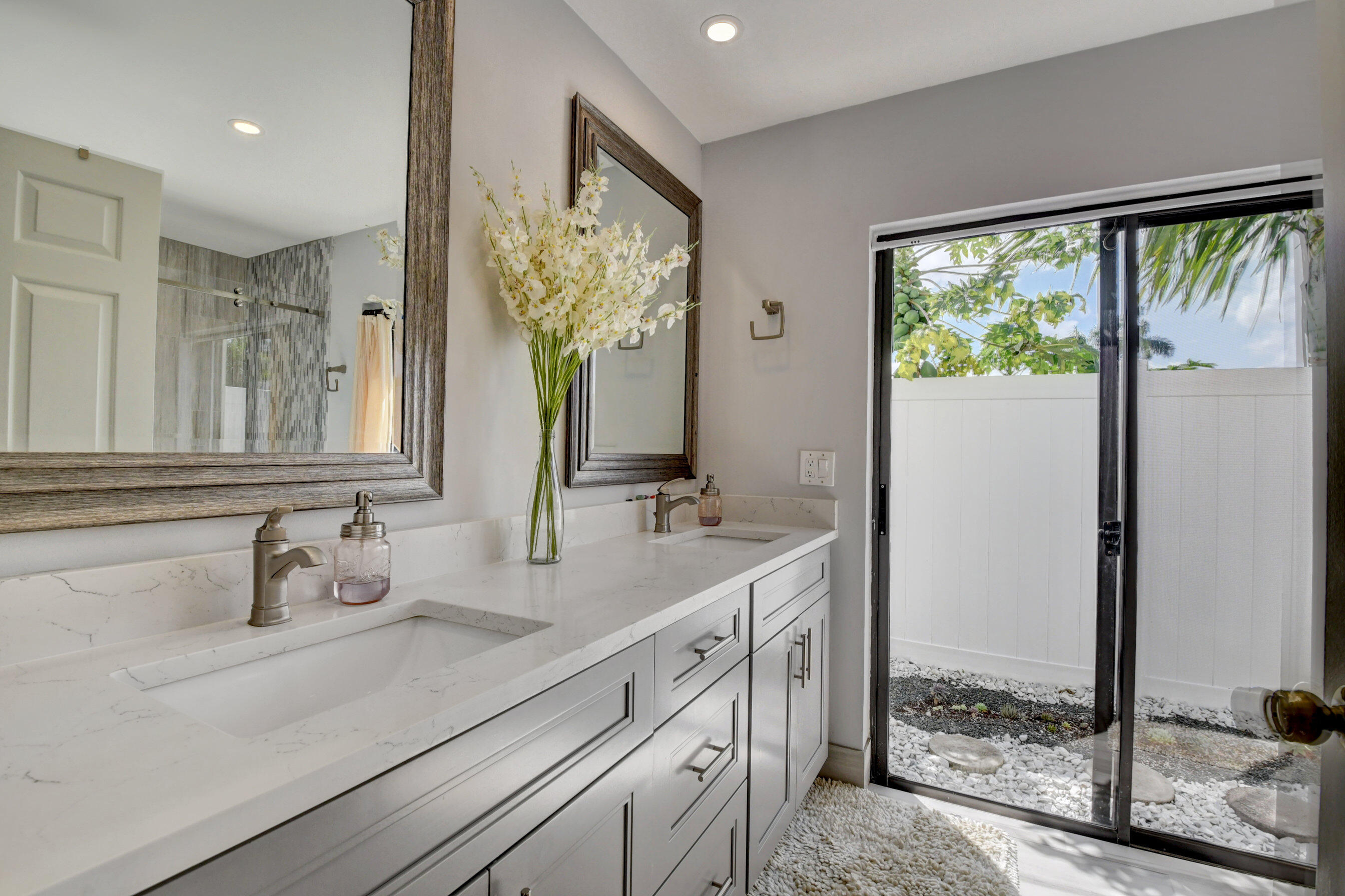 4192 Woods End Road Boca Raton, FL 33487 - Photo 34 of 63 a bathroom with a double vanity sink and a mirror