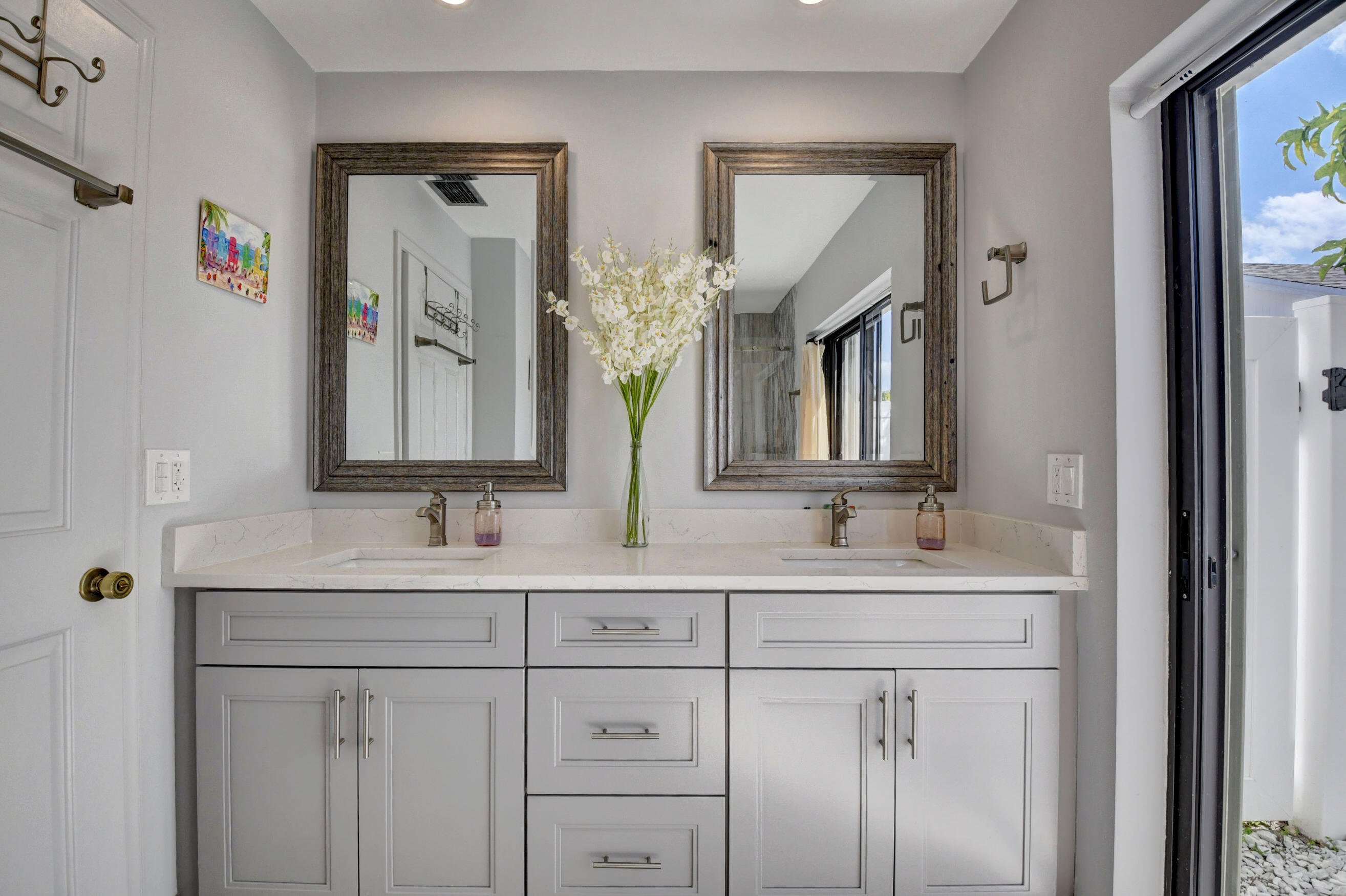 4192 Woods End Road Boca Raton, FL 33487 - Photo 35 of 63 a bathroom with a double vanity sink and mirror
