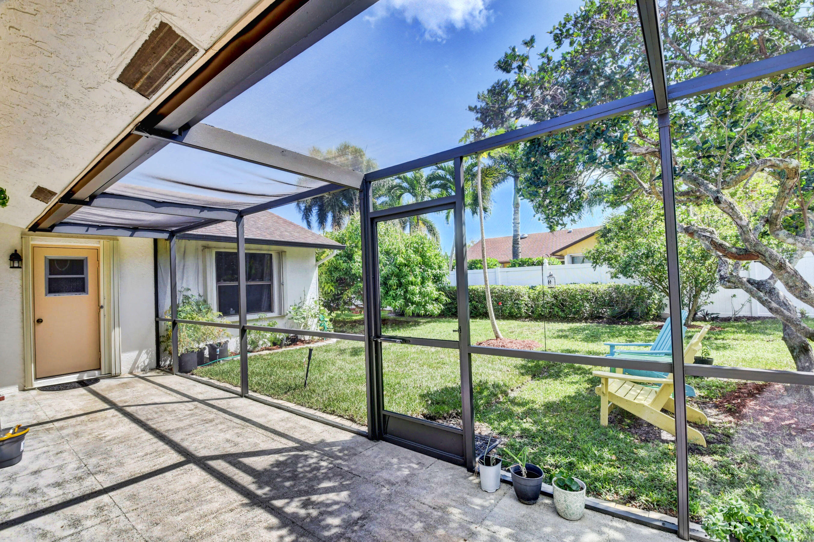 4192 Woods End Road Boca Raton, FL 33487 - Photo 42 of 63 a view of a house with backyard and porch