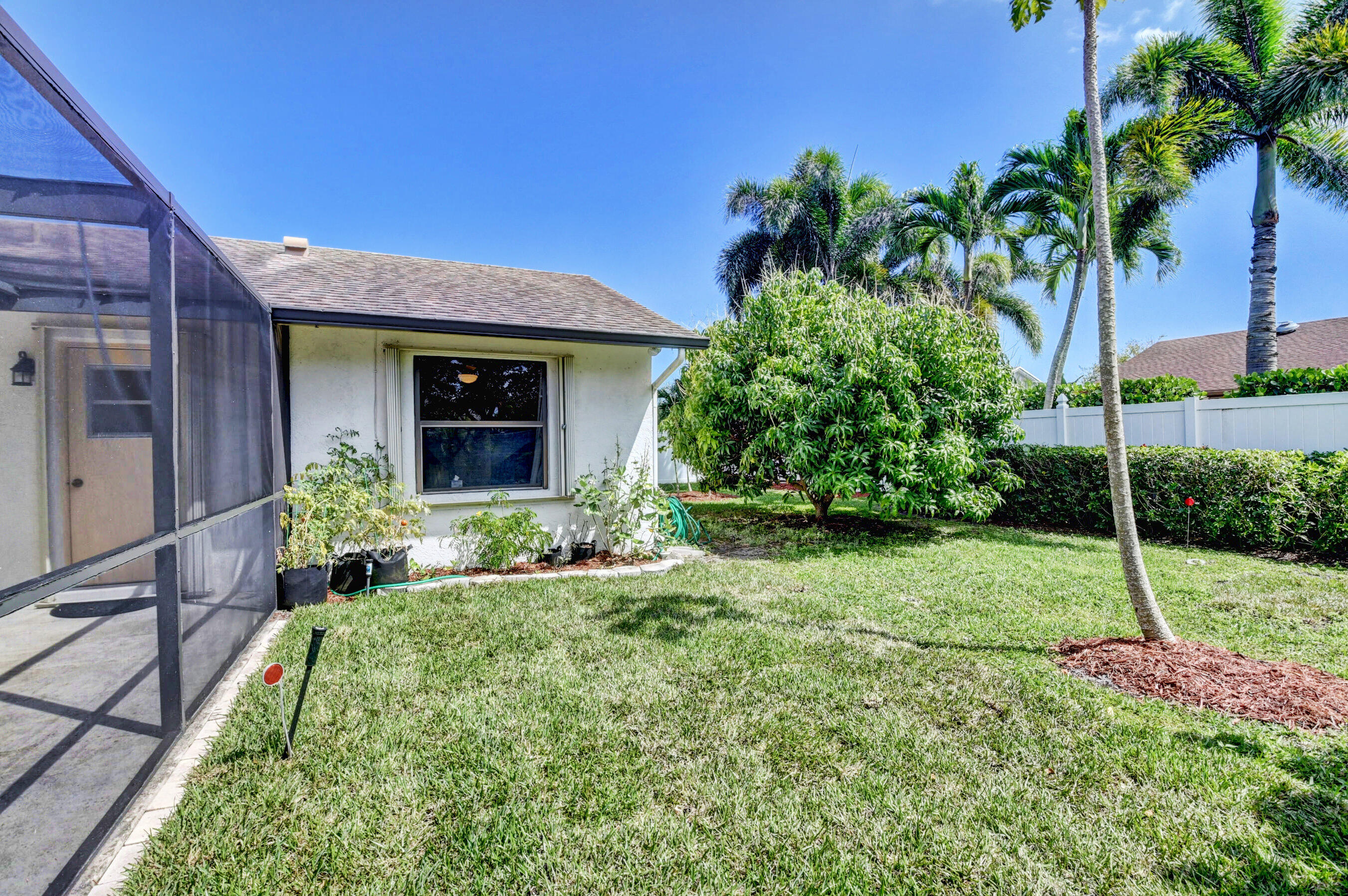 4192 Woods End Road Boca Raton, FL 33487 - Photo 44 of 63 a house view with a garden space