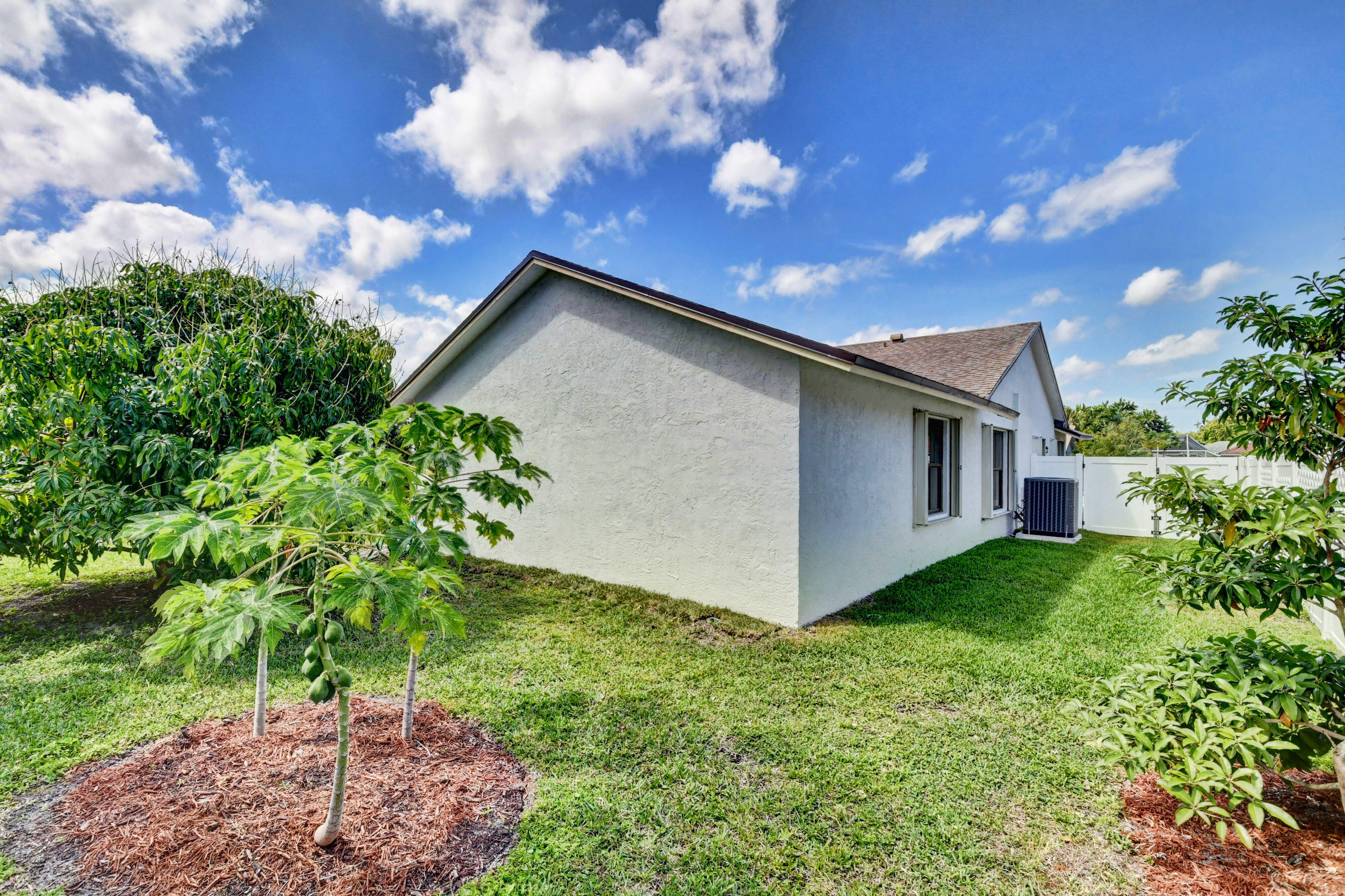 4192 Woods End Road Boca Raton, FL 33487 - Photo 6 of 63 a view of a backyard with potted plants