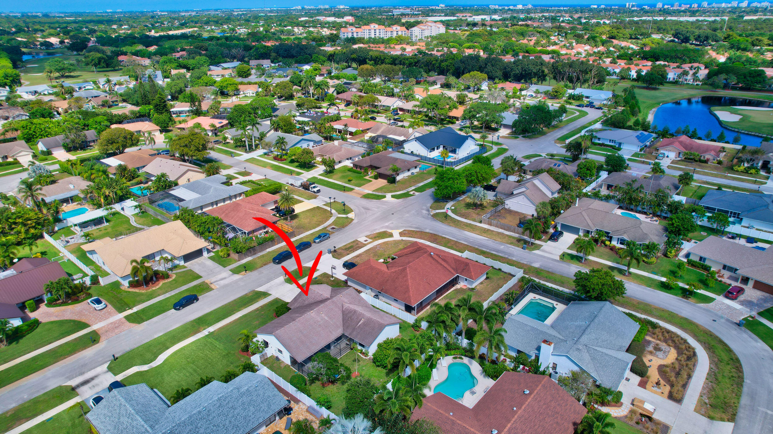 4192 Woods End Road Boca Raton, FL 33487 - Photo 61 of 63 an aerial view of residential houses with outdoor space and parking