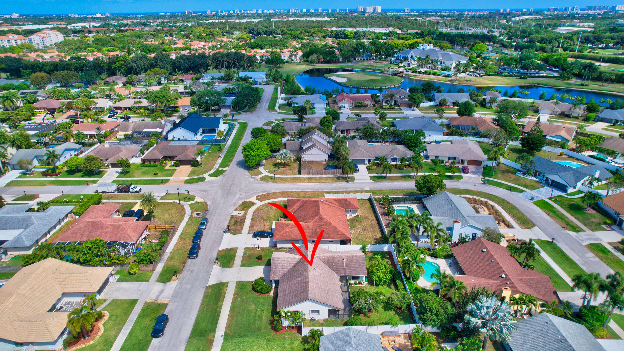 4192 Woods End Road Boca Raton, FL 33487 - Photo 62 of 63 an aerial view of residential houses with outdoor space and parking