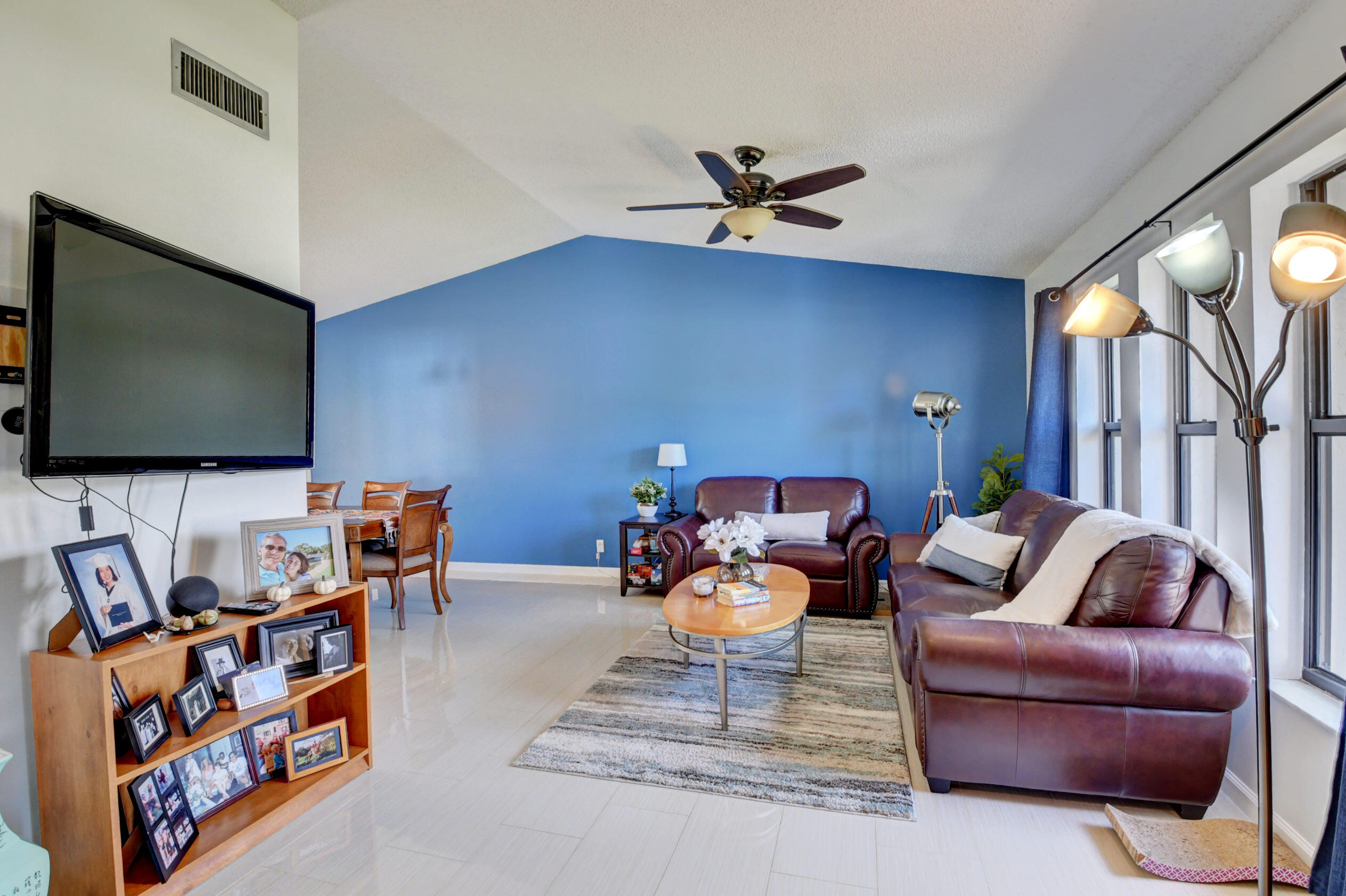 4192 Woods End Road Boca Raton, FL 33487 - Photo 8 of 63 a living room with furniture and a flat screen tv