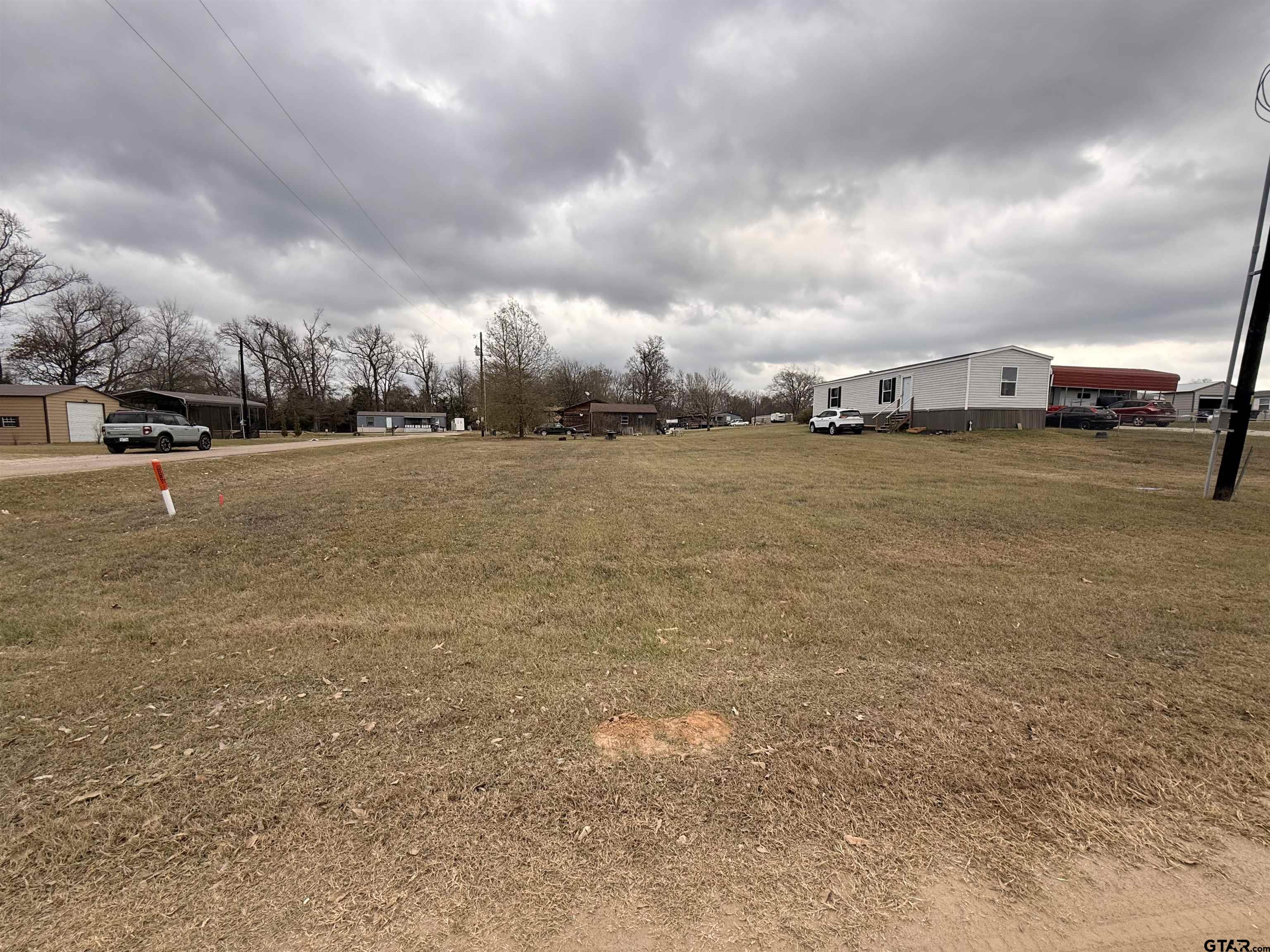 0 Waterfront Row, Unit 213 Quitman, TX 75783 - Photo 17 of 24 a view of a terrace with yard