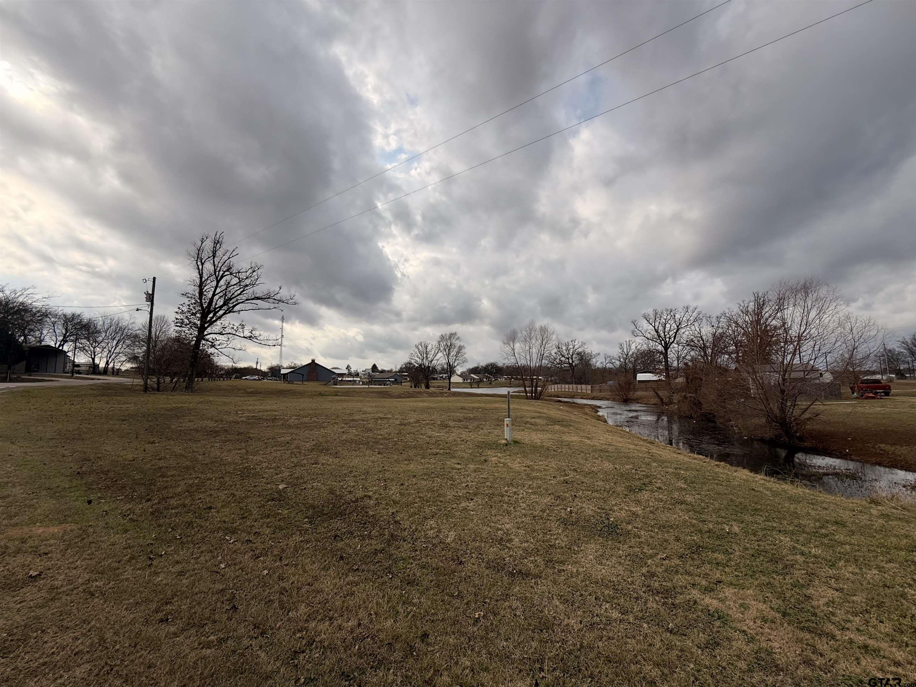 0 Waterfront Row, Unit 213 Quitman, TX 75783 - Photo 21 of 24 a view of a lake with houses