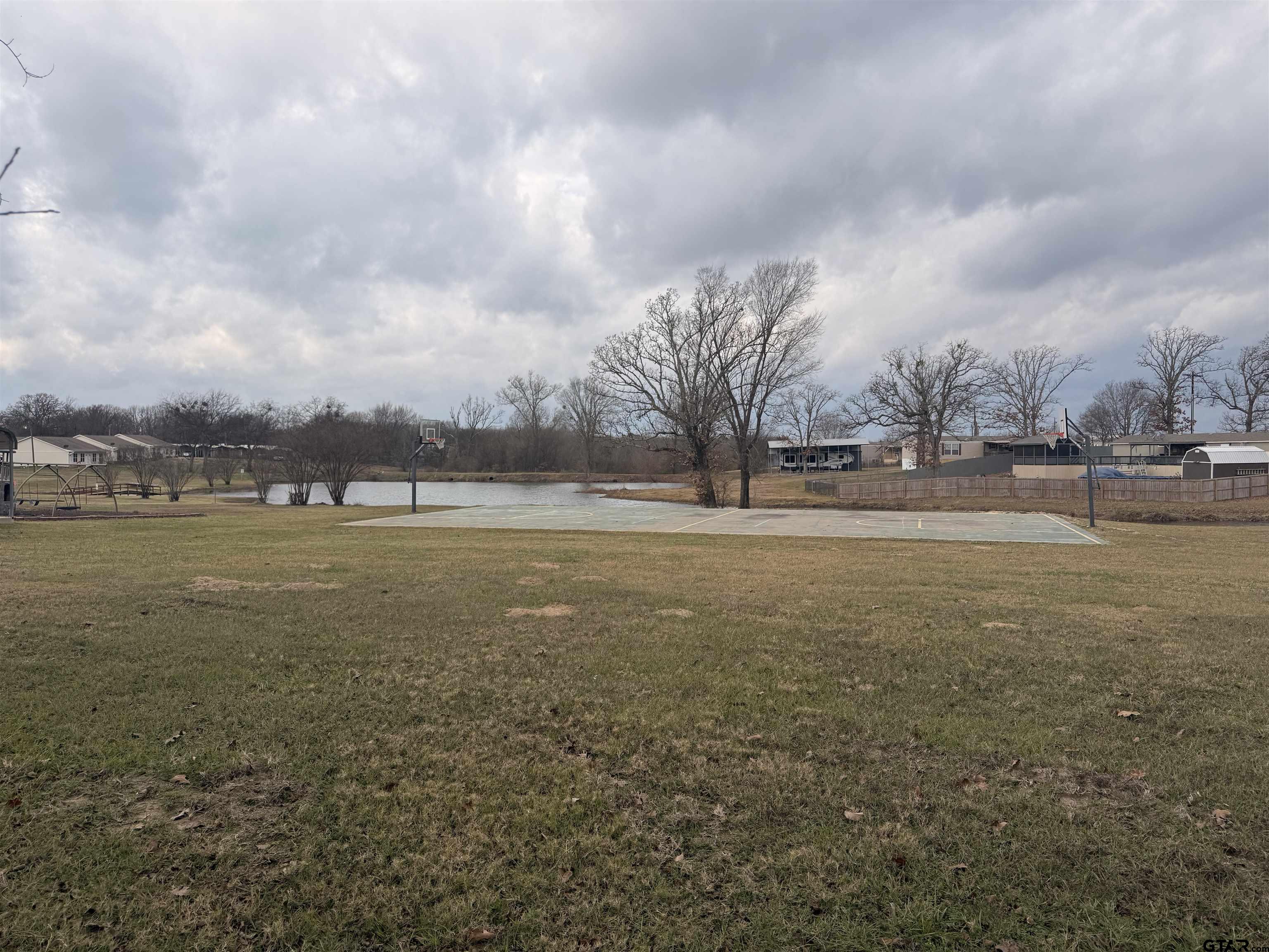 0 Waterfront Row, Unit 213 Quitman, TX 75783 - Photo 23 of 24 a view of yard with lake and trees