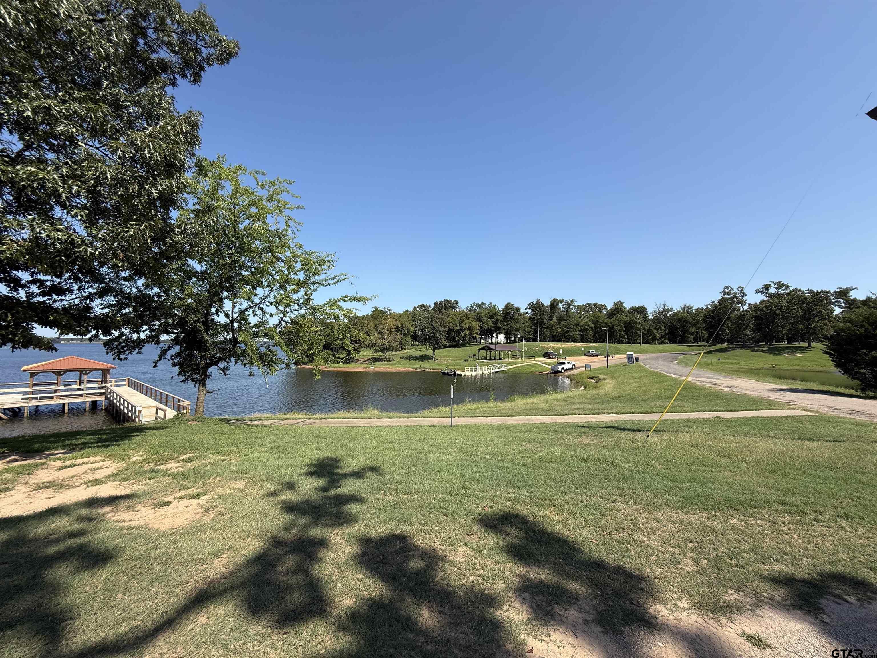 0 Waterfront Row, Unit 213 Quitman, TX 75783 - Photo 5 of 24 a view of a lake from a yard