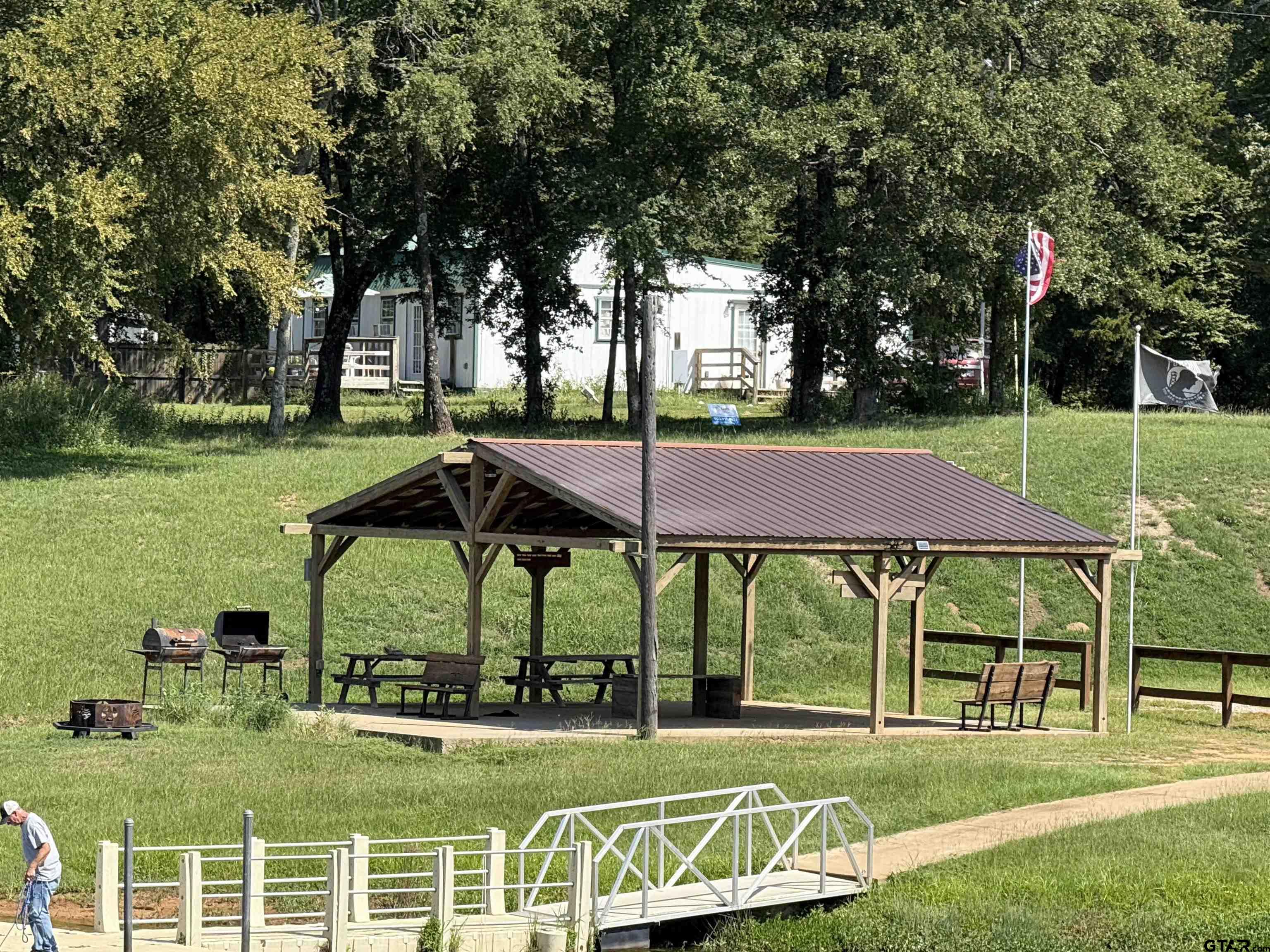 0 Waterfront Row, Unit 213 Quitman, TX 75783 - Photo 8 of 24 a view of pool with lawn chairs and large trees