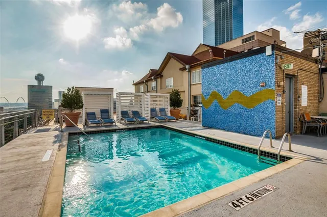 a view of a house with swimming pool yard and sitting area