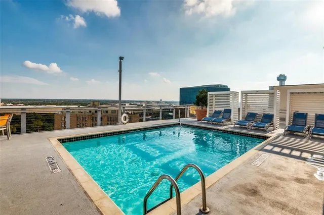 a view of a swimming pool with chairs