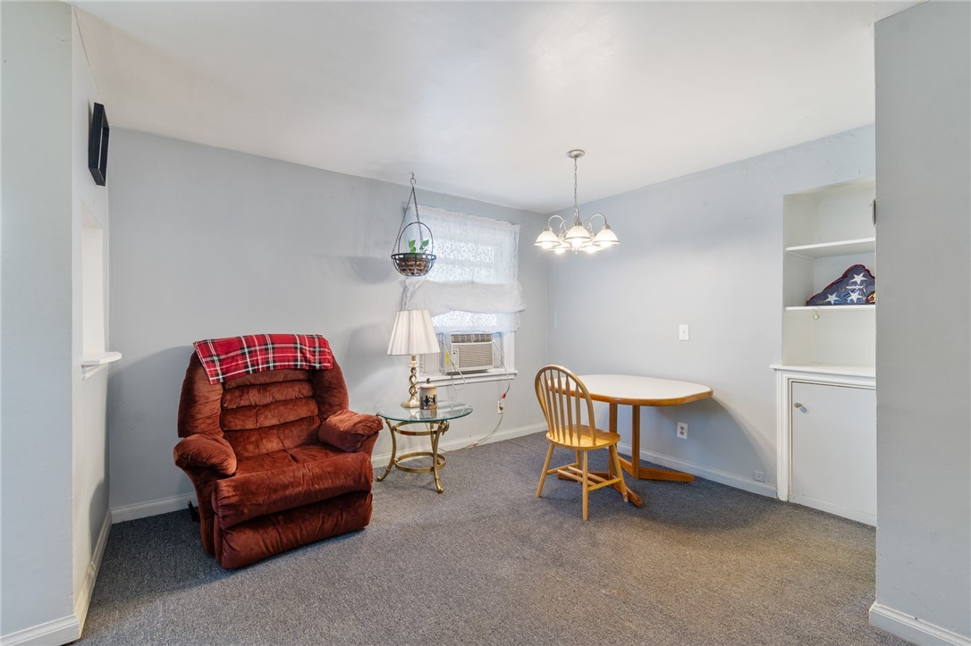 206 English Road Greece, NY 14616 - Photo 7 of 24 The living /dining area - opens to the kitchen