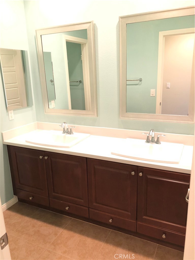 41299 St Croix Temecula, CA 92591 - Photo 14 of 17 a bathroom with a sink and a mirror