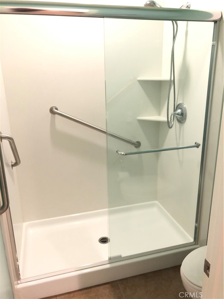 41299 St Croix Temecula, CA 92591 - Photo 15 of 17 a bathroom with a shower and a toilet