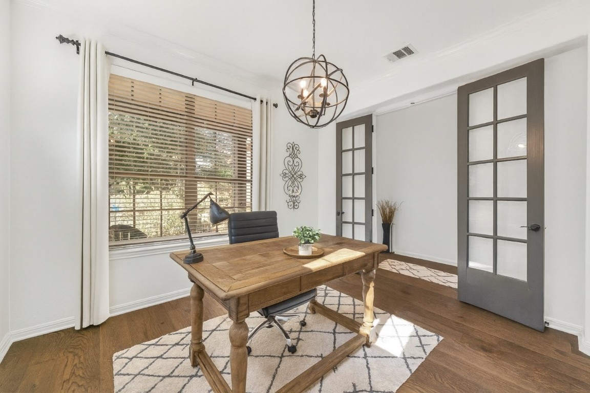 12404 Mediterra Place Austin, TX 78732 - Photo 14 of 39 a view of a dining room with furniture window and wooden floor