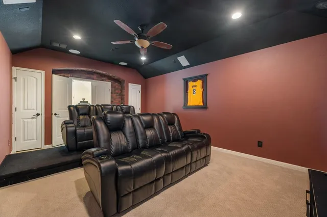 a living room with couches and painted walls