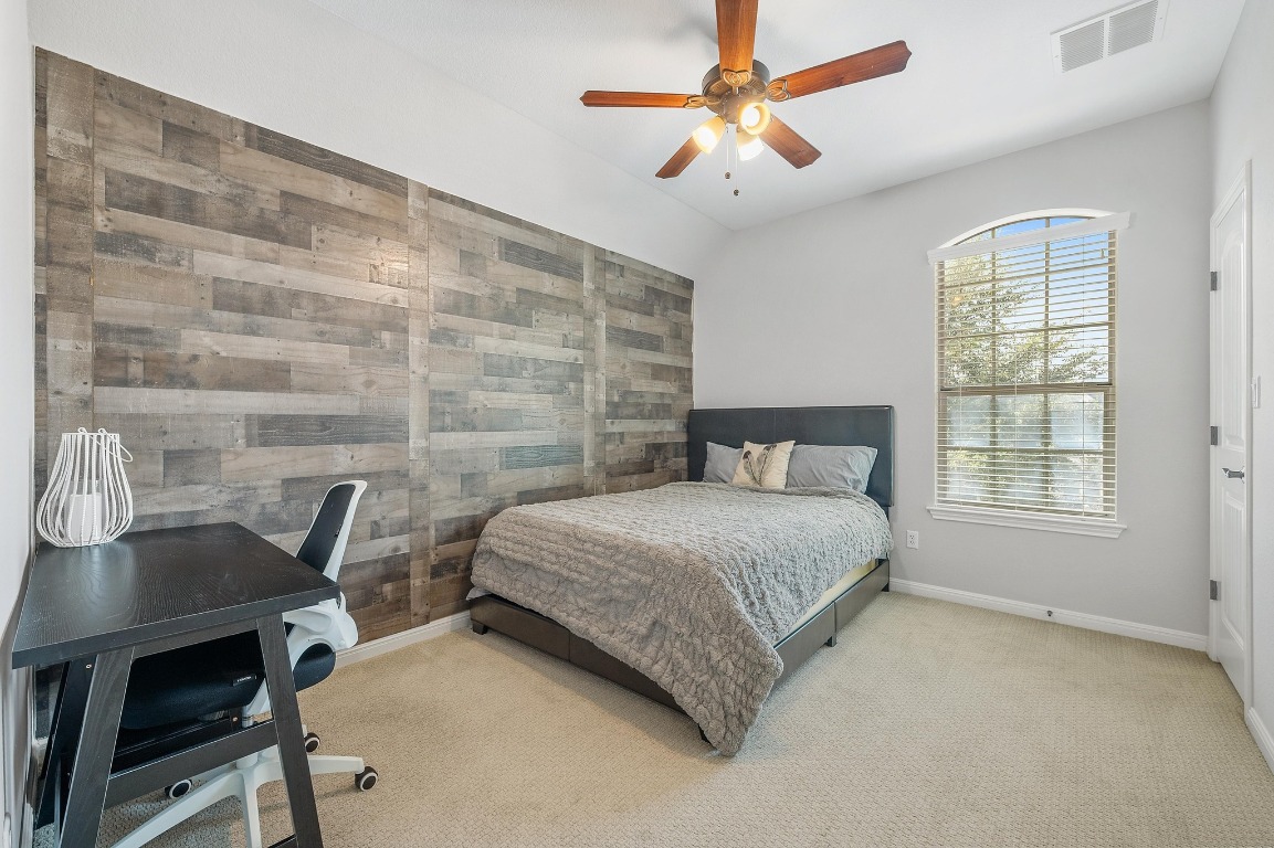 12404 Mediterra Place Austin, TX 78732 - Photo 29 of 39 a bedroom with a bed and a table in it