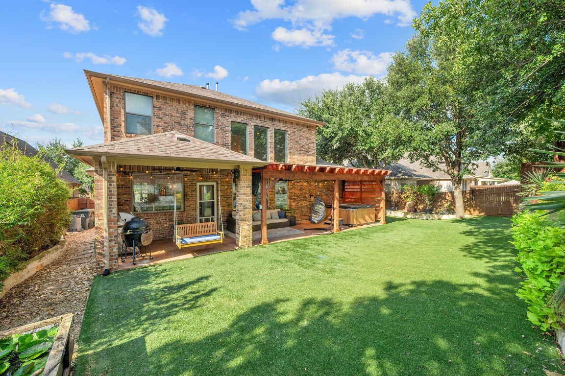 12404 Mediterra Place Austin, TX 78732 - Photo 37 of 39 a view of a house with a yard and sitting area