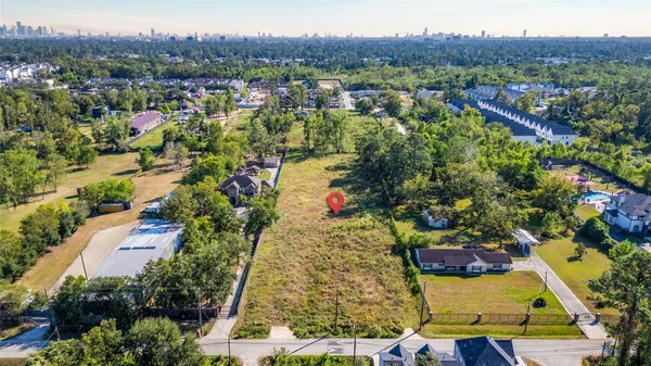 an aerial view of residential house and outdoor space