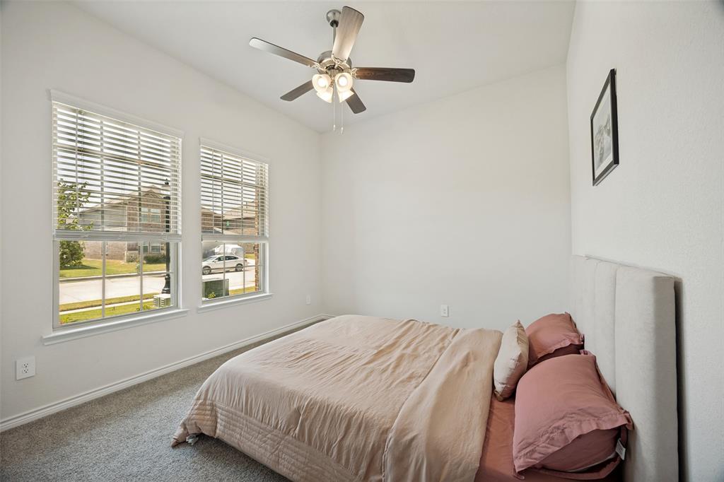 3816 Blacksmith Road Aubrey, TX 76227 - Photo 10 of 30 Carpeted room with vaulted ceiling and a ceiling fan with integrated lighting
