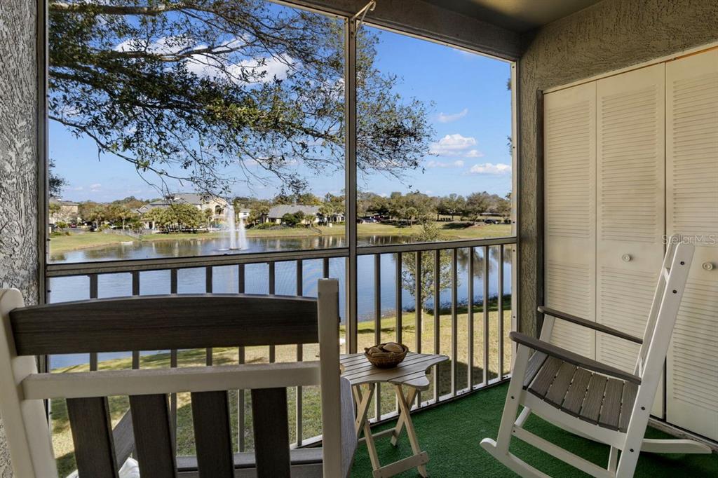 1438 Millstream Lane, Unit 203 Dunedin, FL 34698 - Photo 15 of 60 a view of a balcony with wooden floor