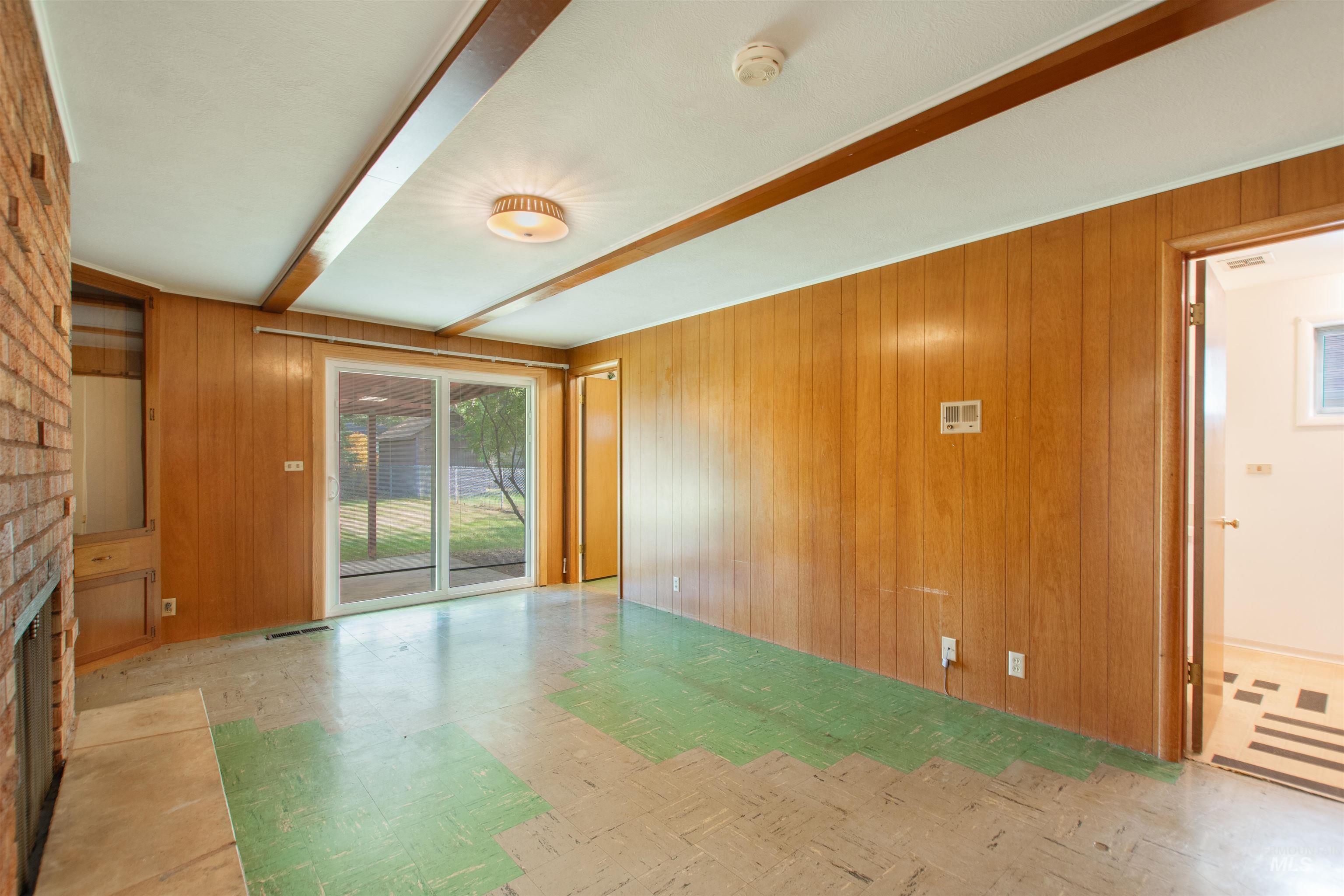 2716 North Redway Road Boise, ID 83704 - Photo 10 of 36 Wood-paneled walls and ceiling beams