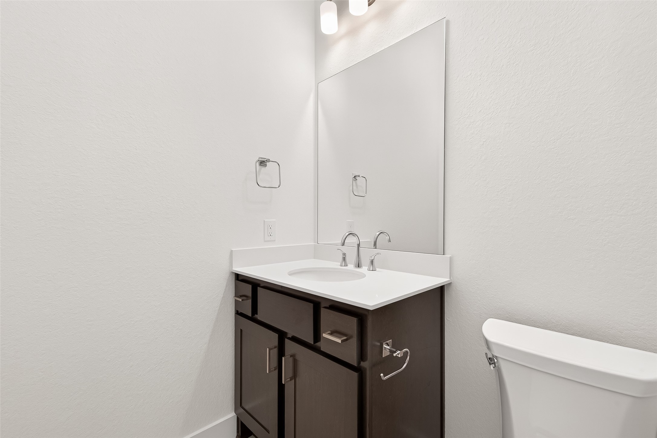 4916 Northern Wds Drive Spring, TX 77386 - Photo 21 of 44 a bathroom with a sink a toilet and a mirror