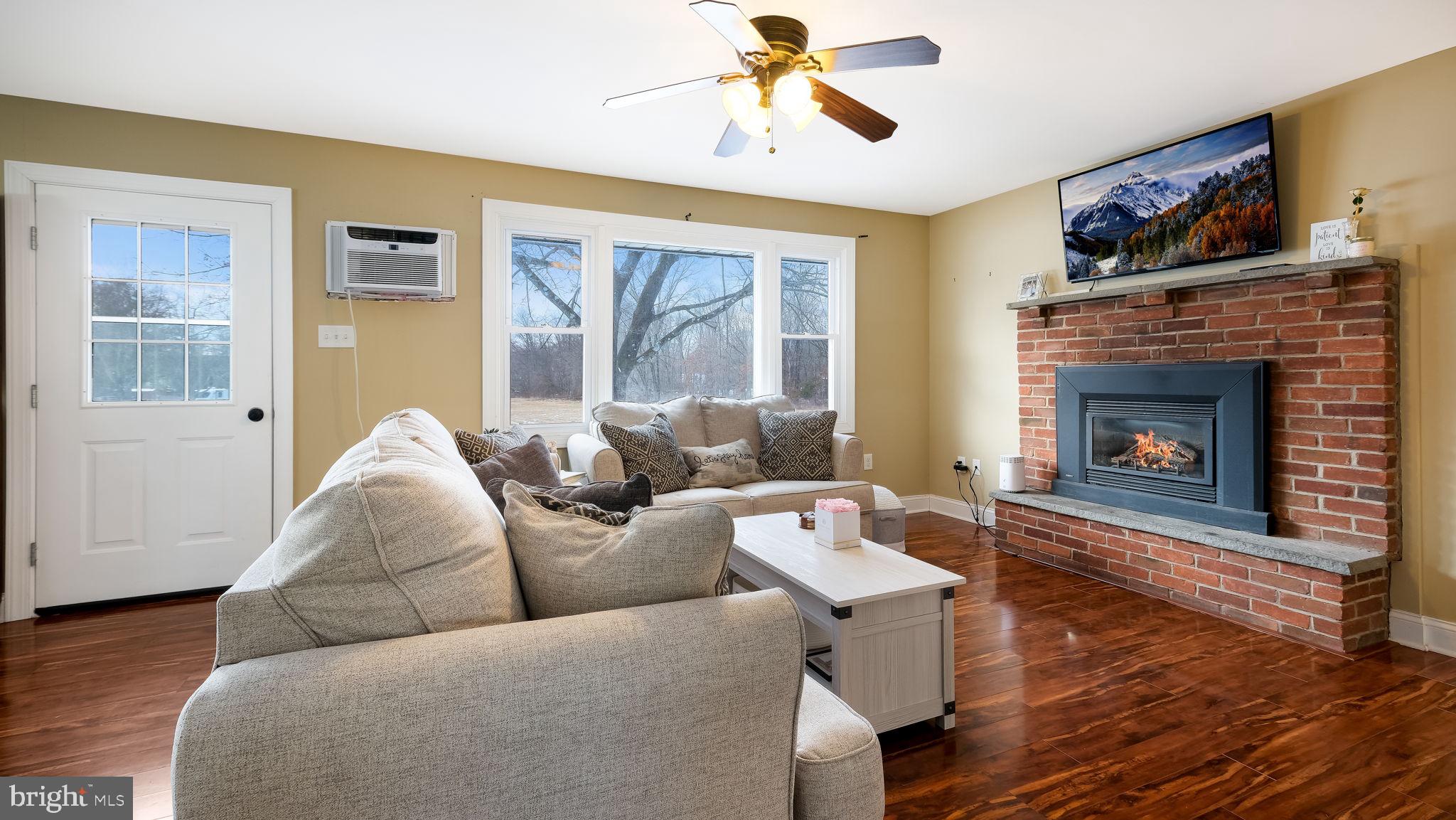 1732 Creek Road New Hope, PA 18938 - Photo 35 of 52 a living room with furniture and a fireplace