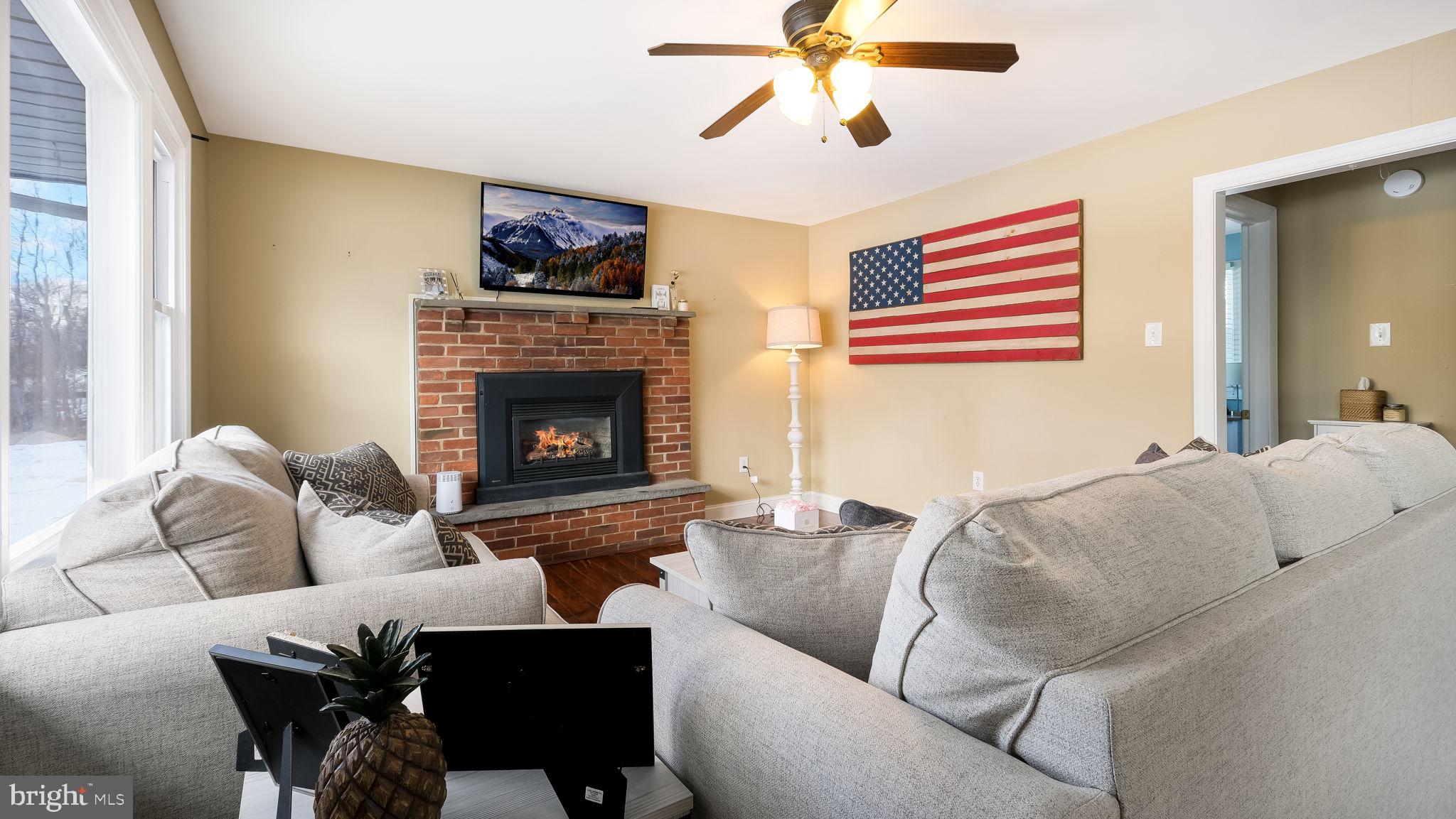 1732 Creek Road New Hope, PA 18938 - Photo 36 of 52 a living room with furniture and a fireplace