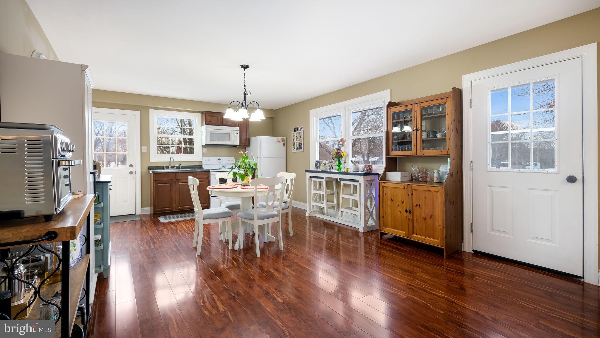1732 Creek Road New Hope, PA 18938 - Photo 38 of 52 a view of a dining room with furniture window and wooden floor