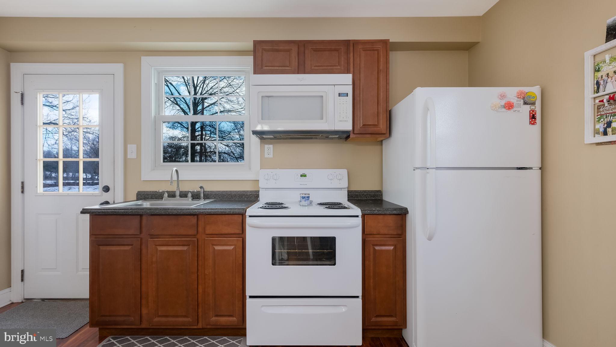 1732 Creek Road New Hope, PA 18938 - Photo 43 of 52 a white refrigerator freezer sitting inside of a kitchen
