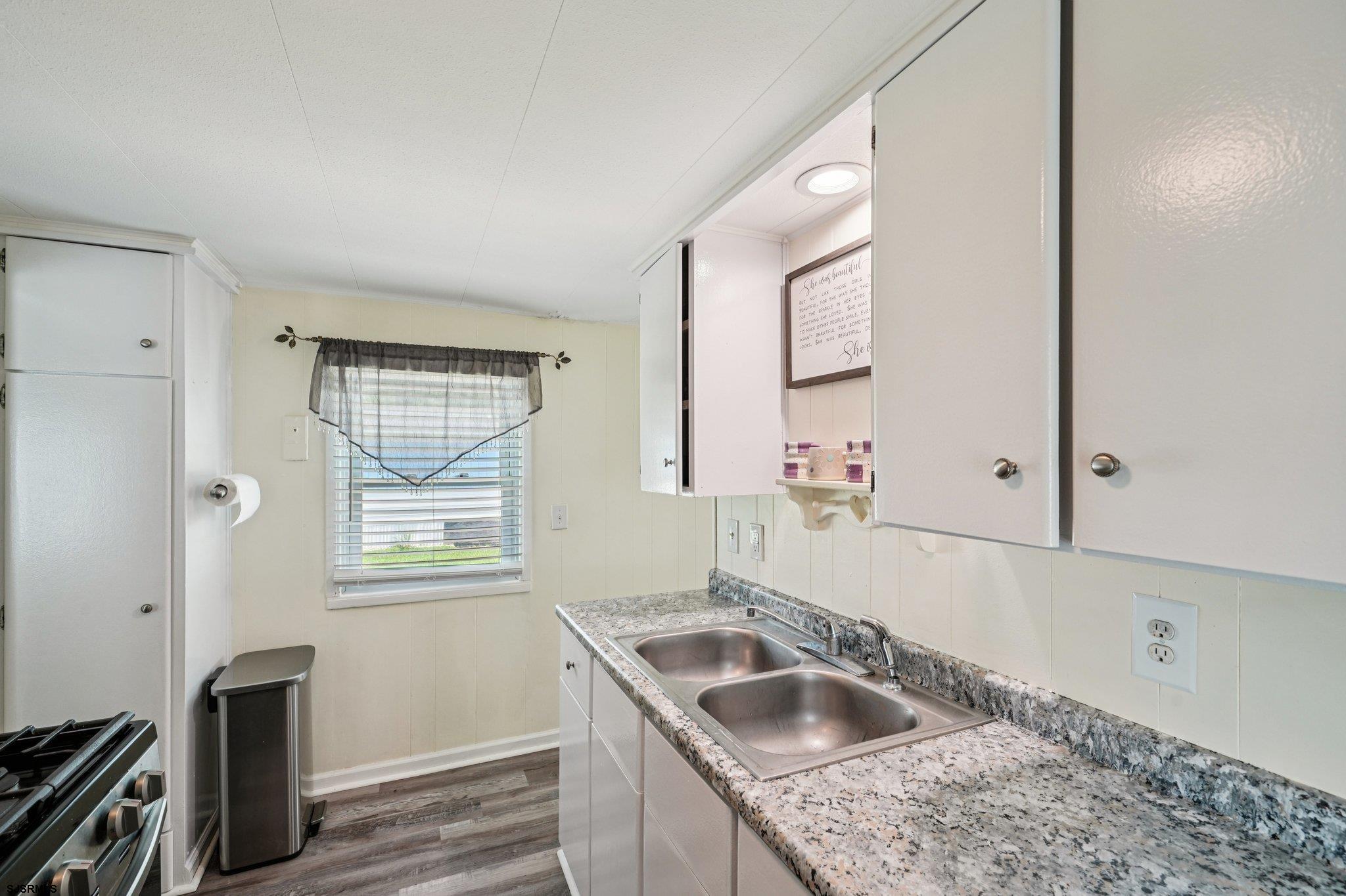 2528 Tilton Road Egg Harbor Township, NJ 08234 - Photo 14 of 31 a kitchen with granite countertop a sink and a window