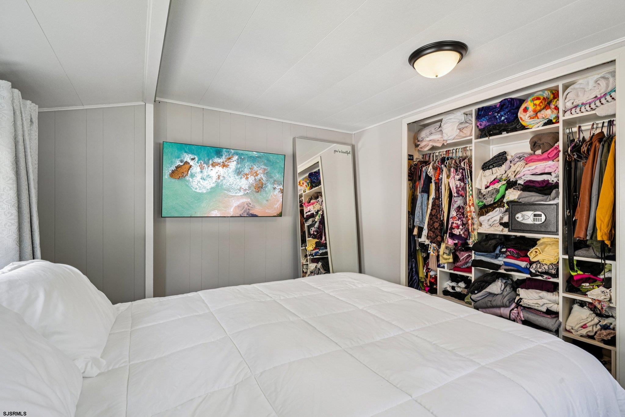 2528 Tilton Road Egg Harbor Township, NJ 08234 - Photo 20 of 31 a bedroom with a bed and a walk in closet