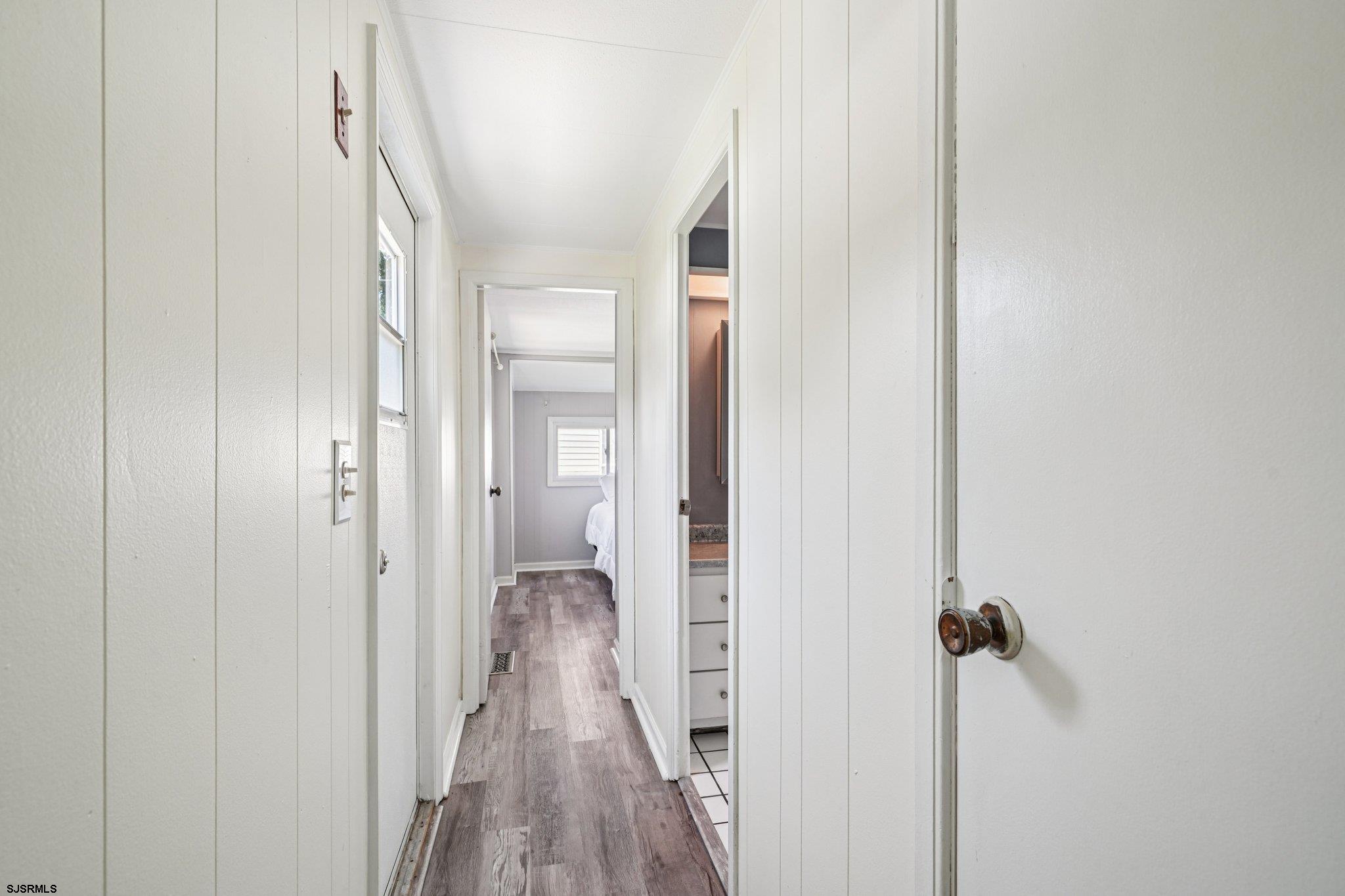 2528 Tilton Road Egg Harbor Township, NJ 08234 - Photo 25 of 31 a view of a hallway with wooden floor and closet area