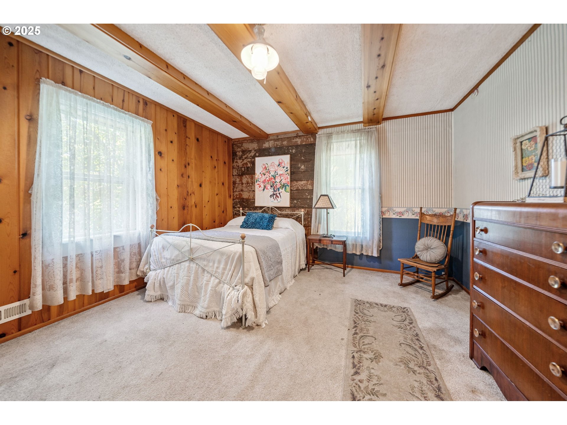 12040 Southeast Revenue Road Boring, OR 97009 - Photo 21 of 46 a bed room with a bed and a chair