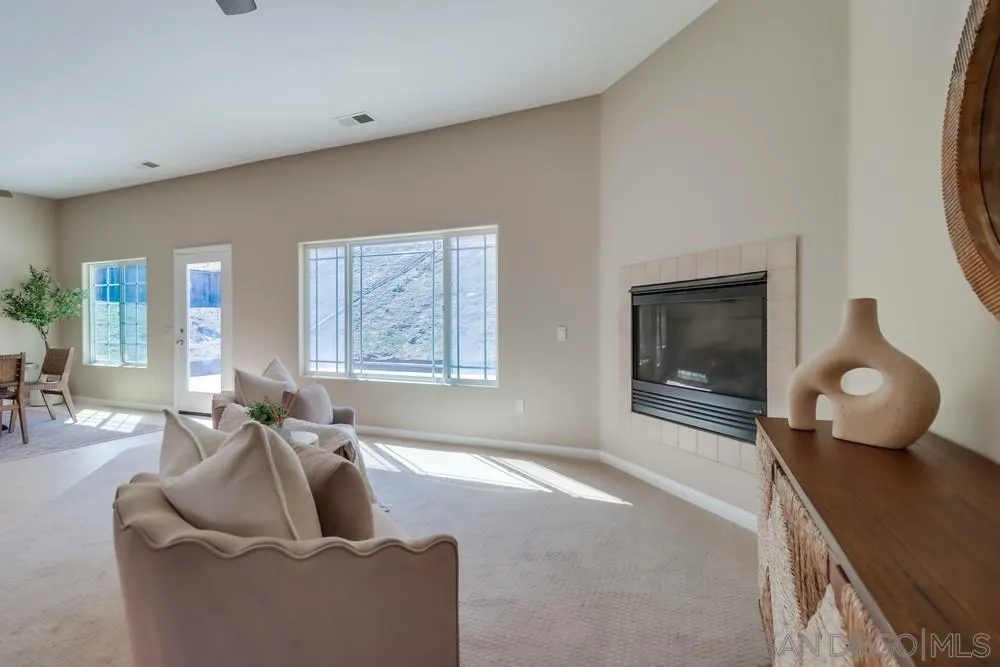 8837 Diamondback Drive Santee, CA 92071 - Photo 13 of 37 a living room with furniture and a fireplace