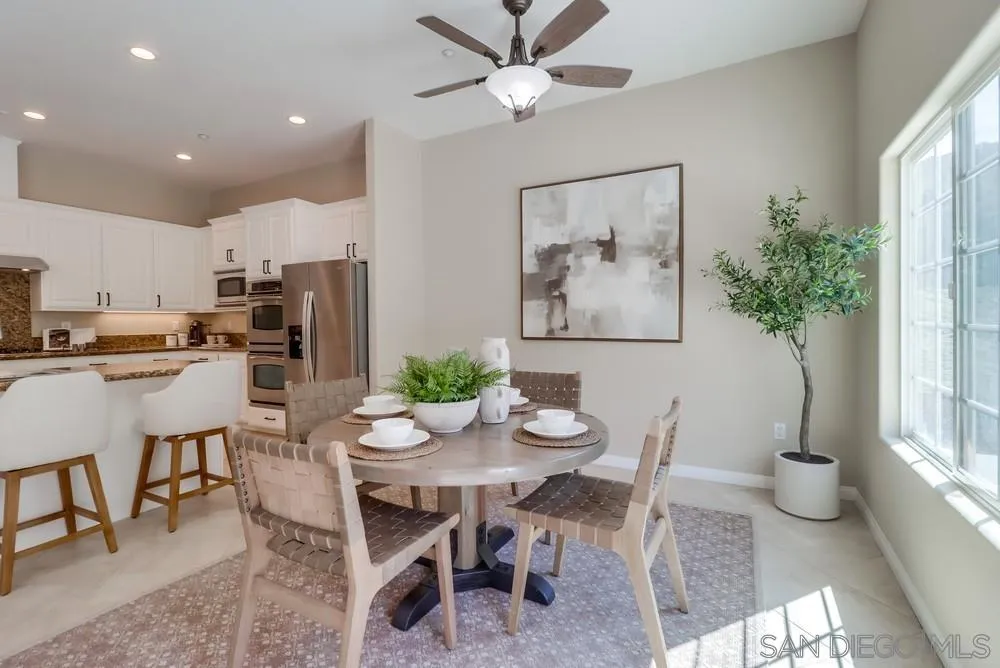 8837 Diamondback Drive Santee, CA 92071 - Photo 14 of 37 a view of a dining room with furniture and a potted plant