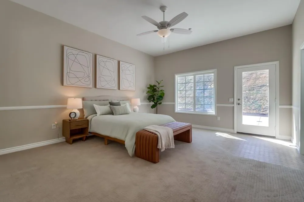 8837 Diamondback Drive Santee, CA 92071 - Photo 17 of 37 a spacious bedroom with a bed and a large window
