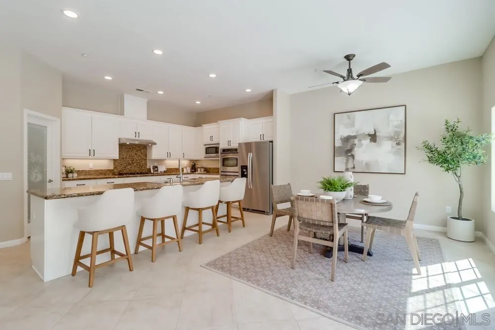 8837 Diamondback Drive Santee, CA 92071 - Photo 9 of 37 a living room with stainless steel appliances kitchen island granite countertop furniture and a dining table